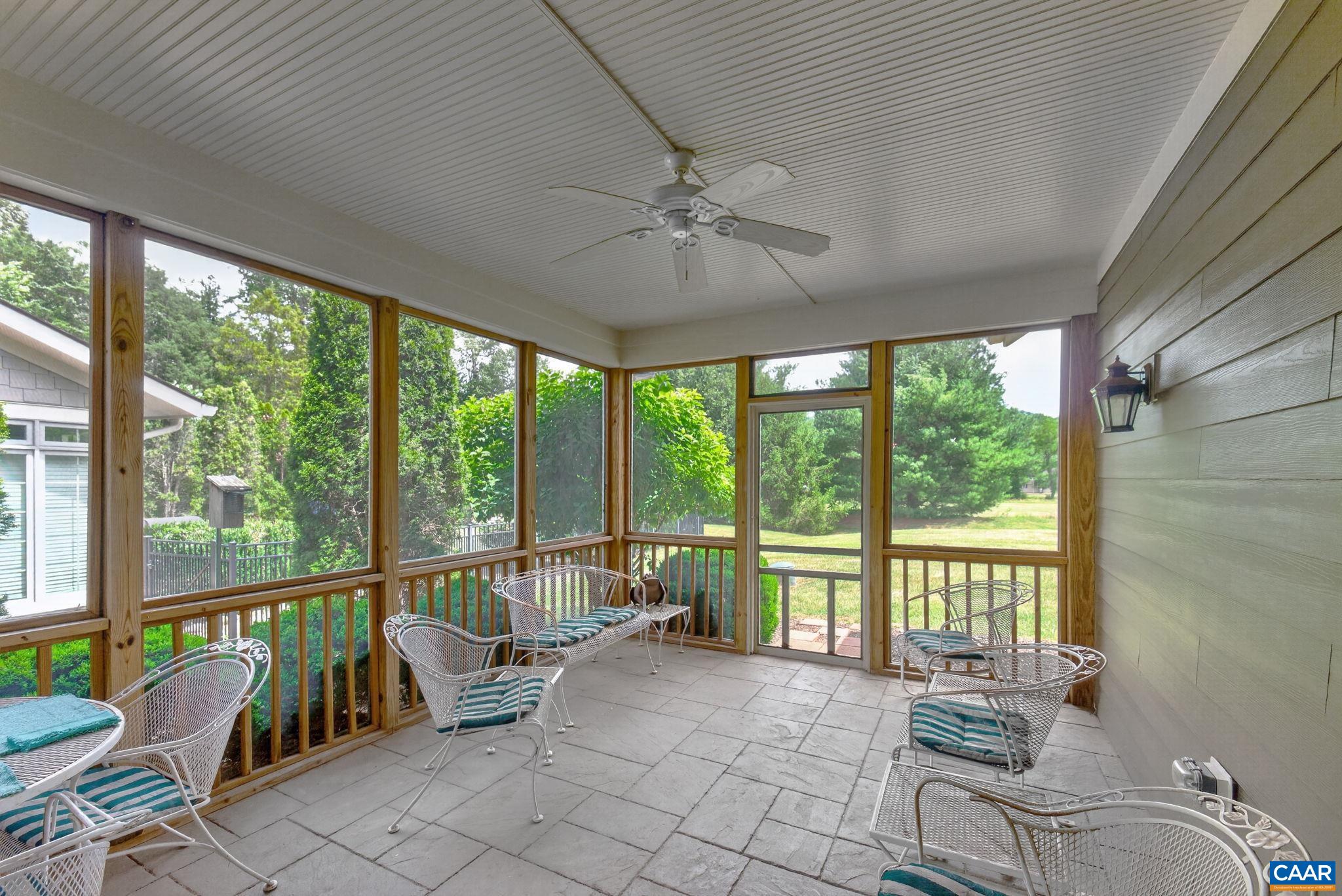 Wonderful screen porch with ceiling fan.