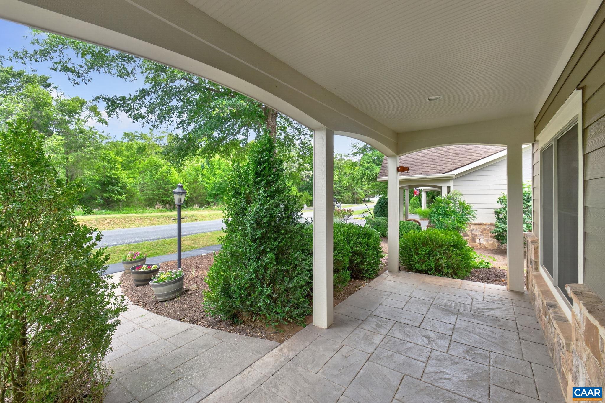 Deep and welcoming stamped concrete front porch.