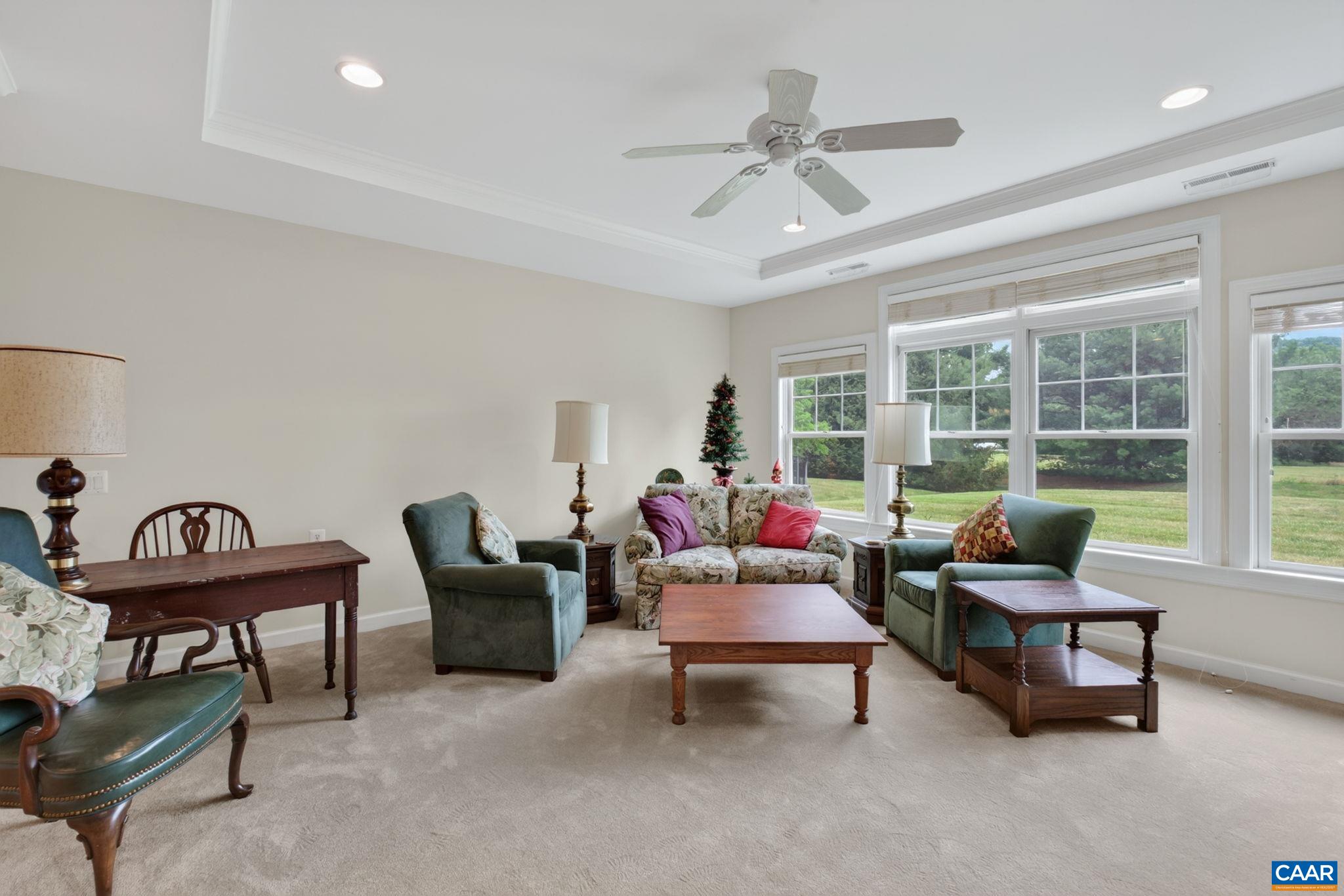 Large living room with new carpet.