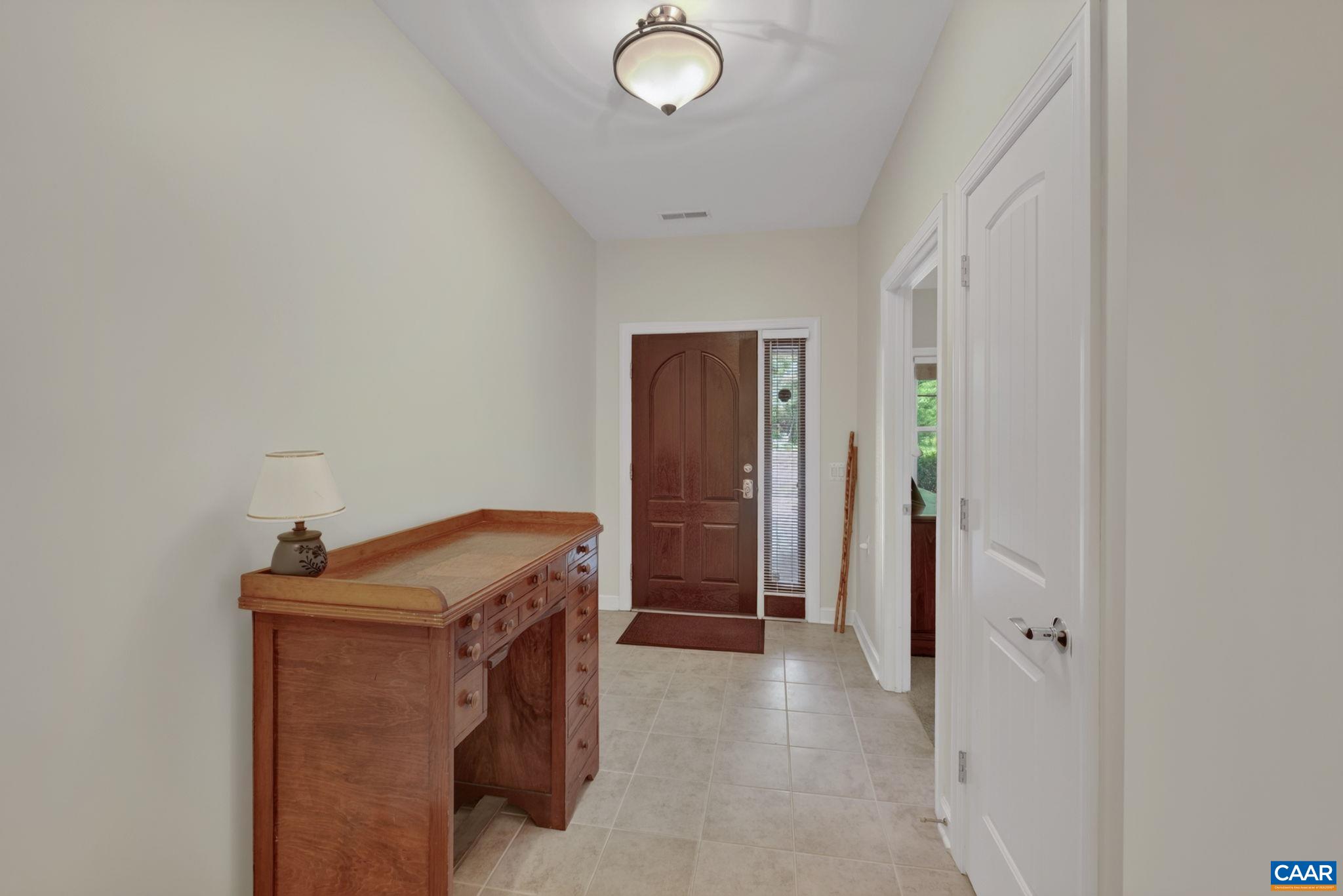 Tiled front foyer upon entering the home.