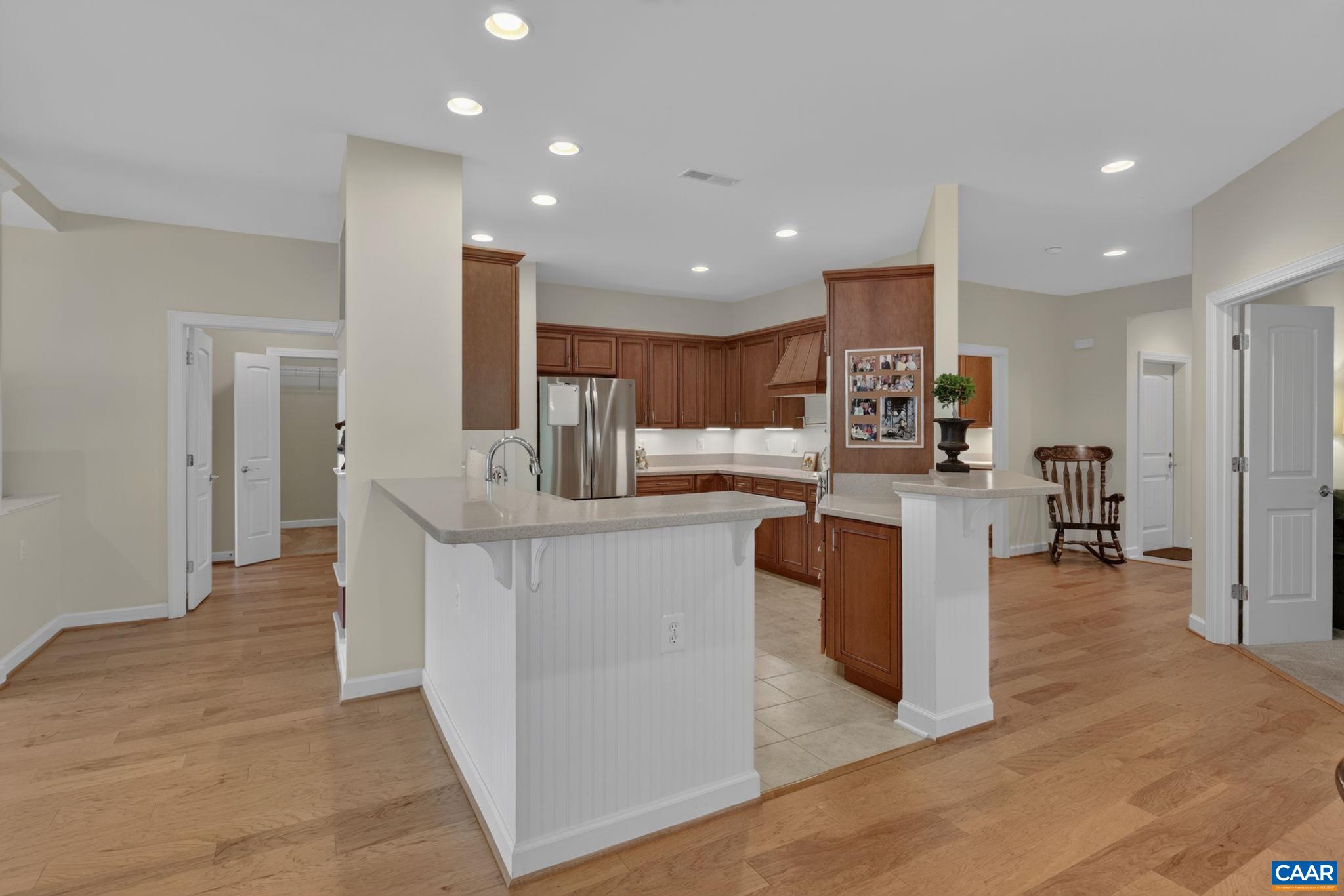 Large kitchen opens to dining and living rooms.