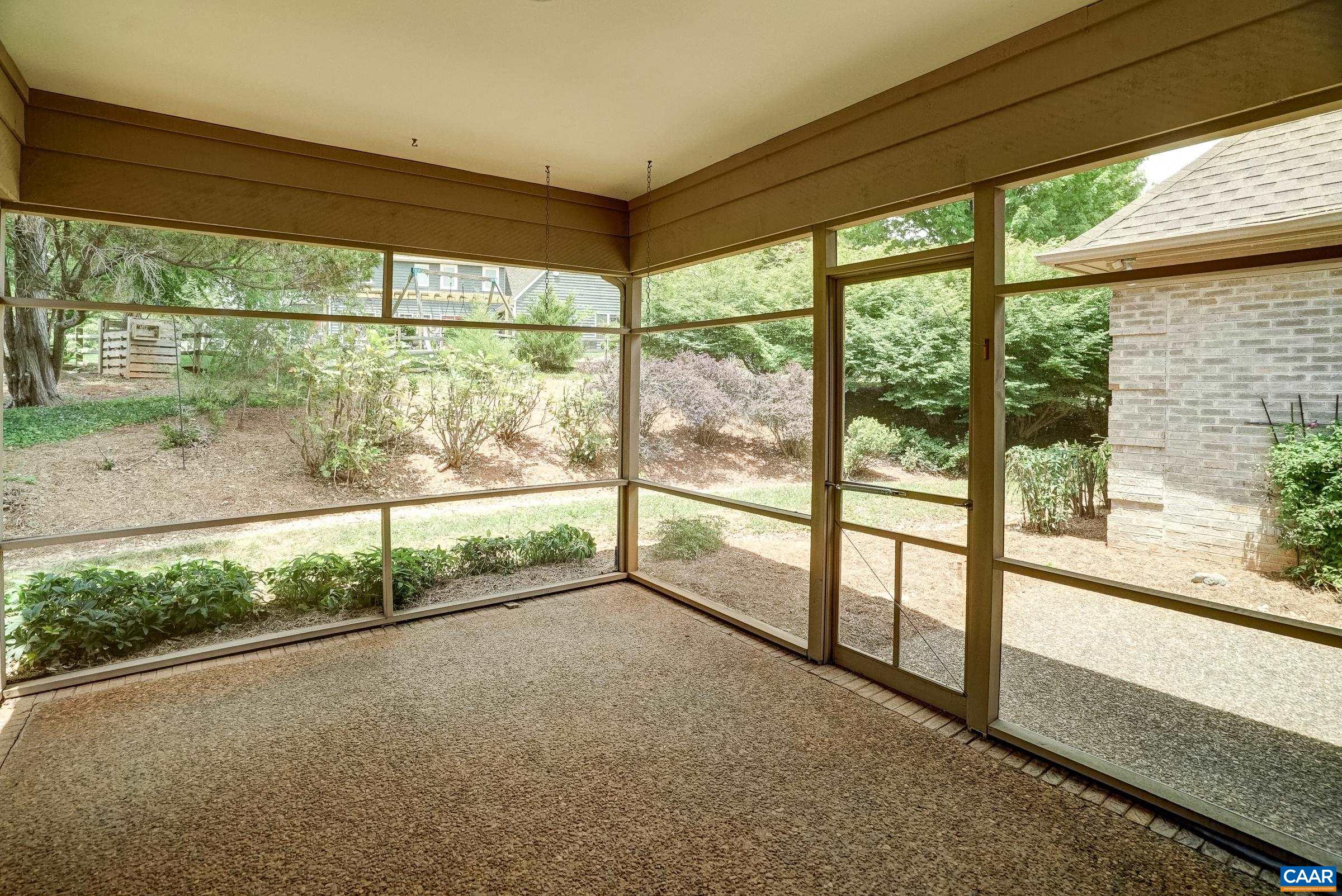 Enjoy outdoor living on the large screened porch.
