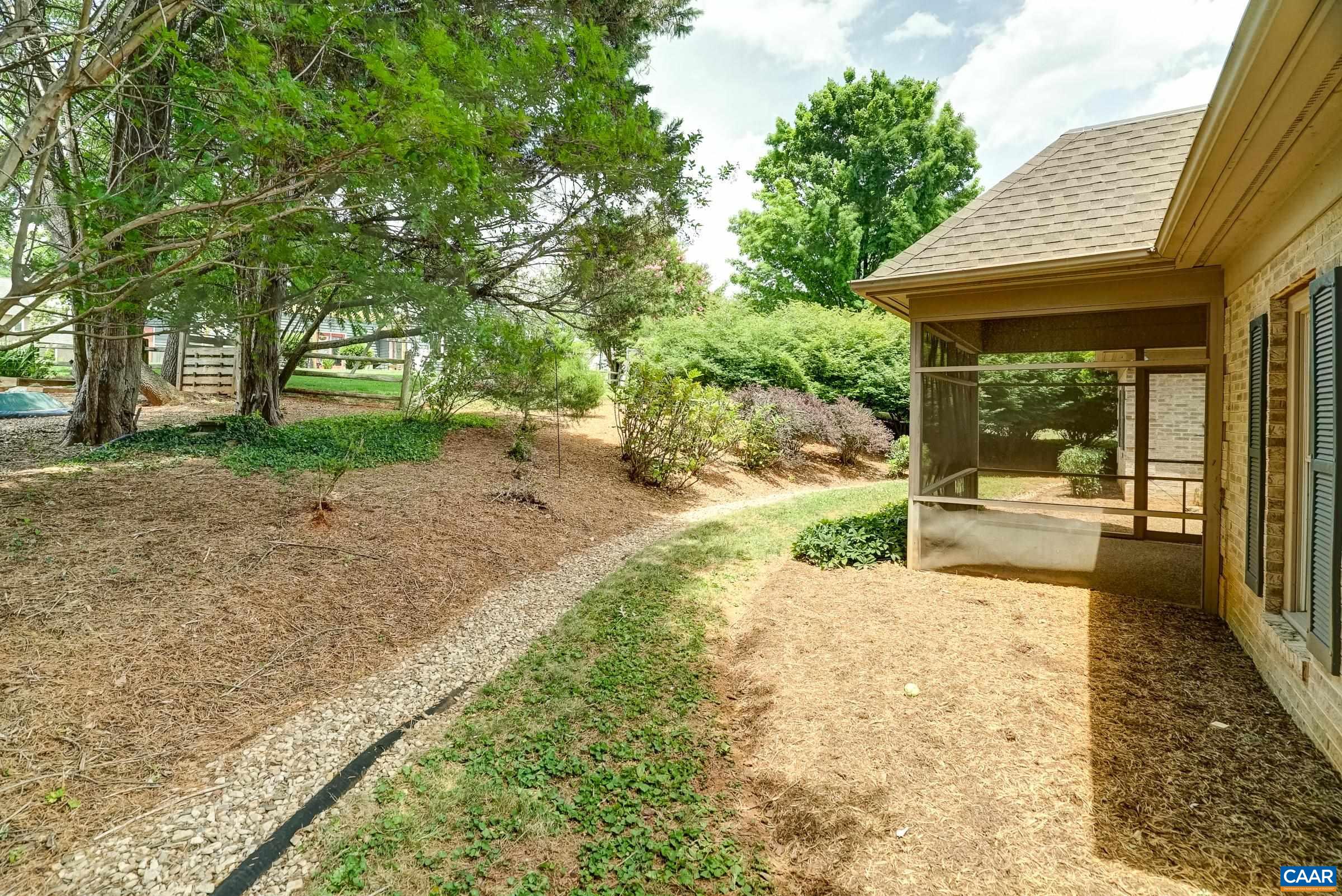 Four sided brick house with private back yard.