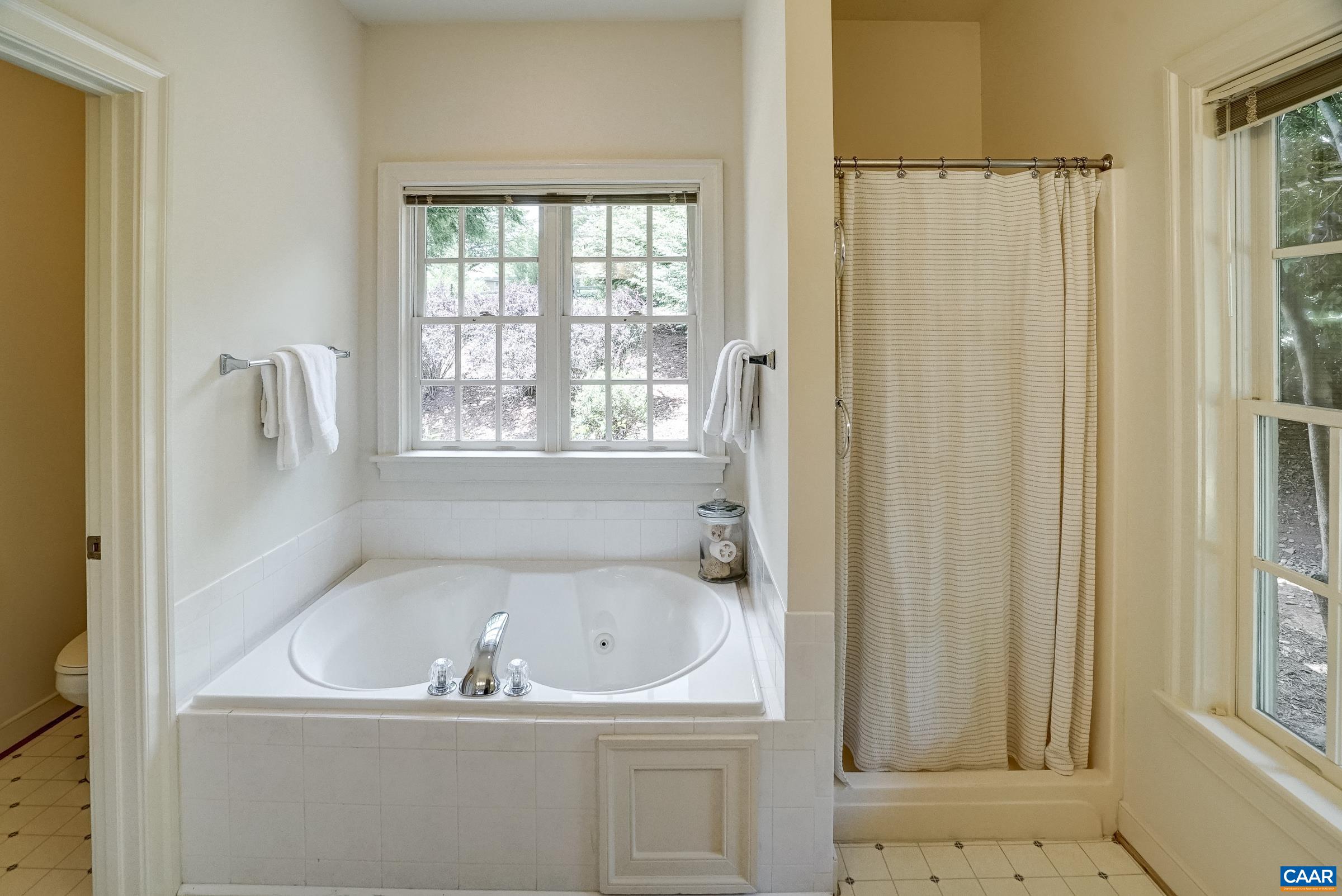 Ensuite bath with soaking tub and separate shower.