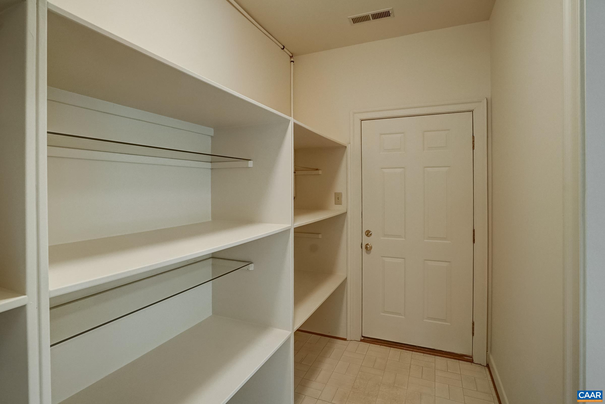 Extended mudroom with shelving.