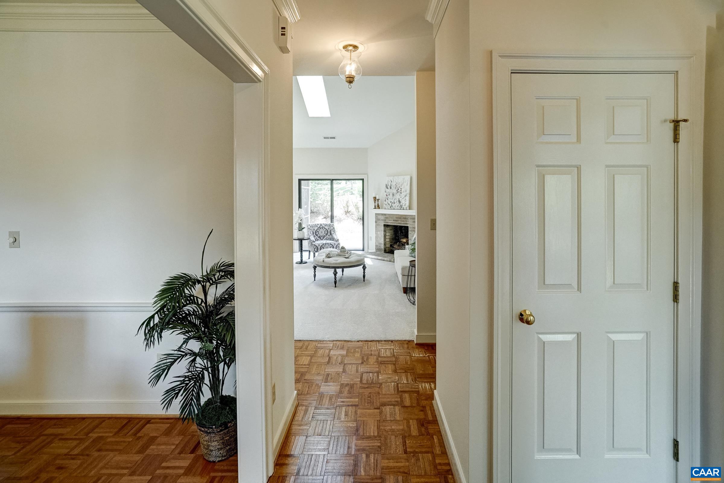 Parquet flooring in the entryway and dining room.