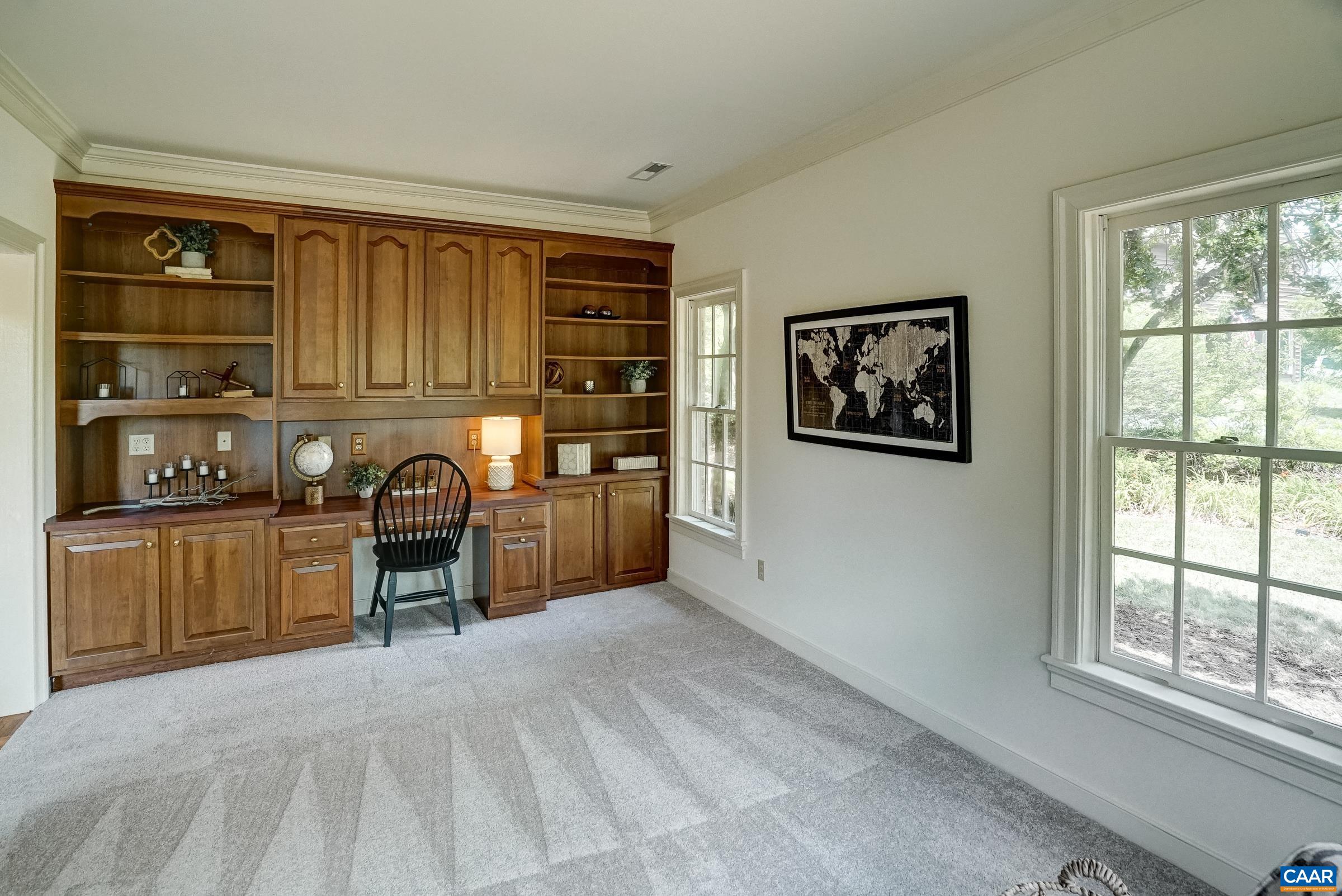 Flexible living room at the front of the home could be a home office or formal living area.