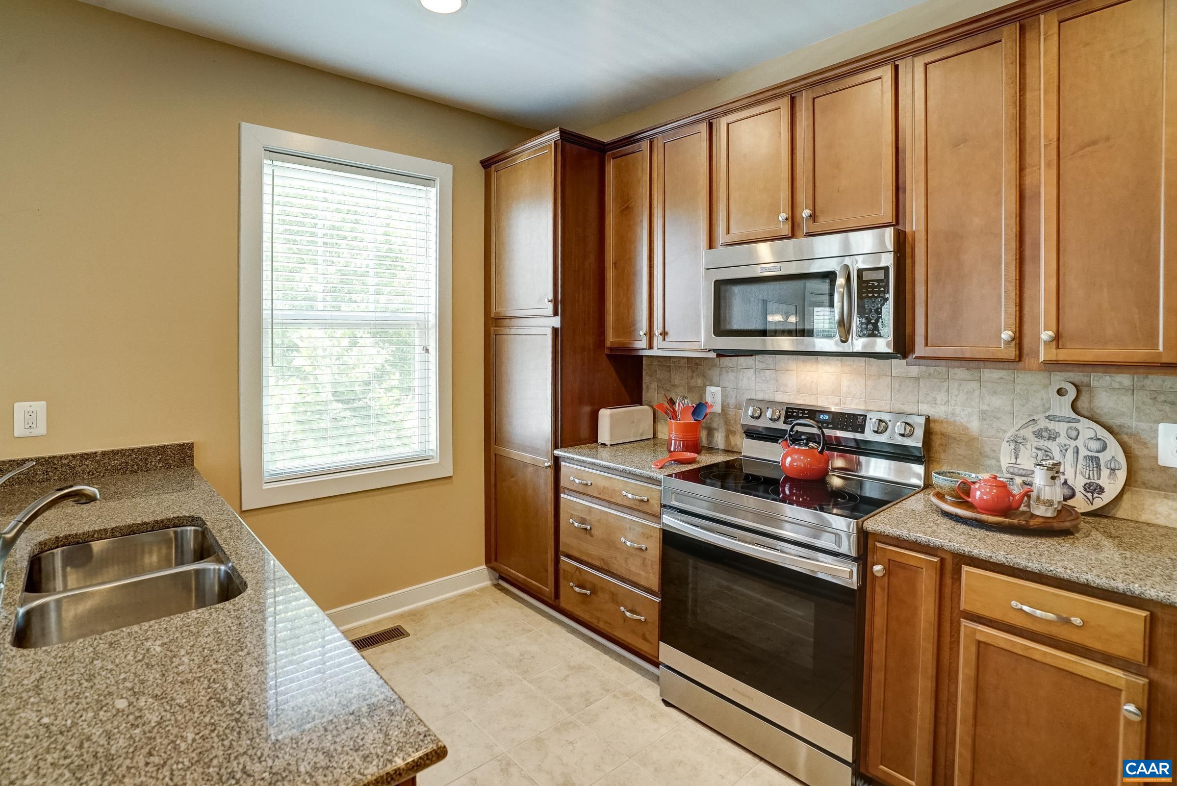 Pantry cabinet and tile backsplash.