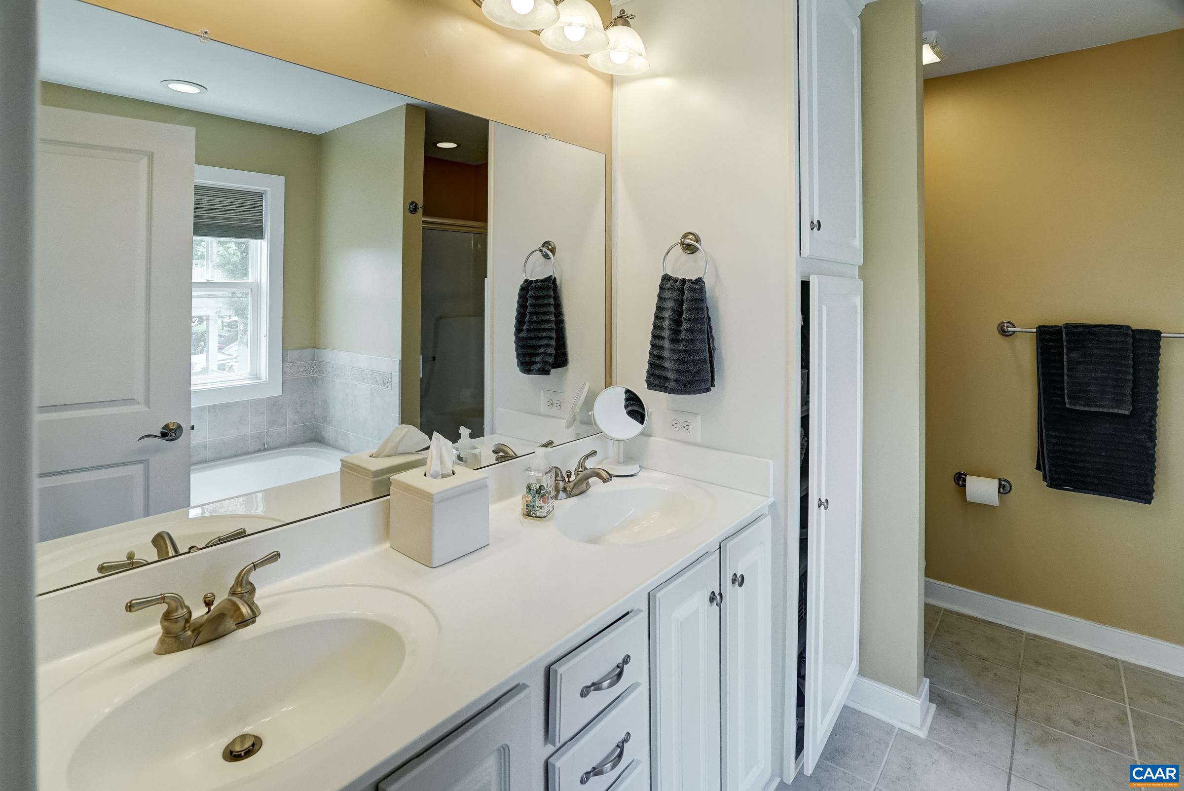 Primary bathroom with double sink vanity.
