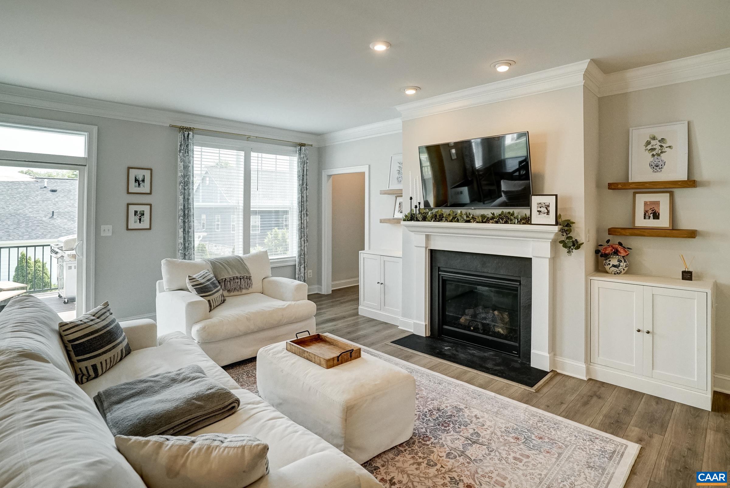 Gas fireplace with built in storage and floating shelves.