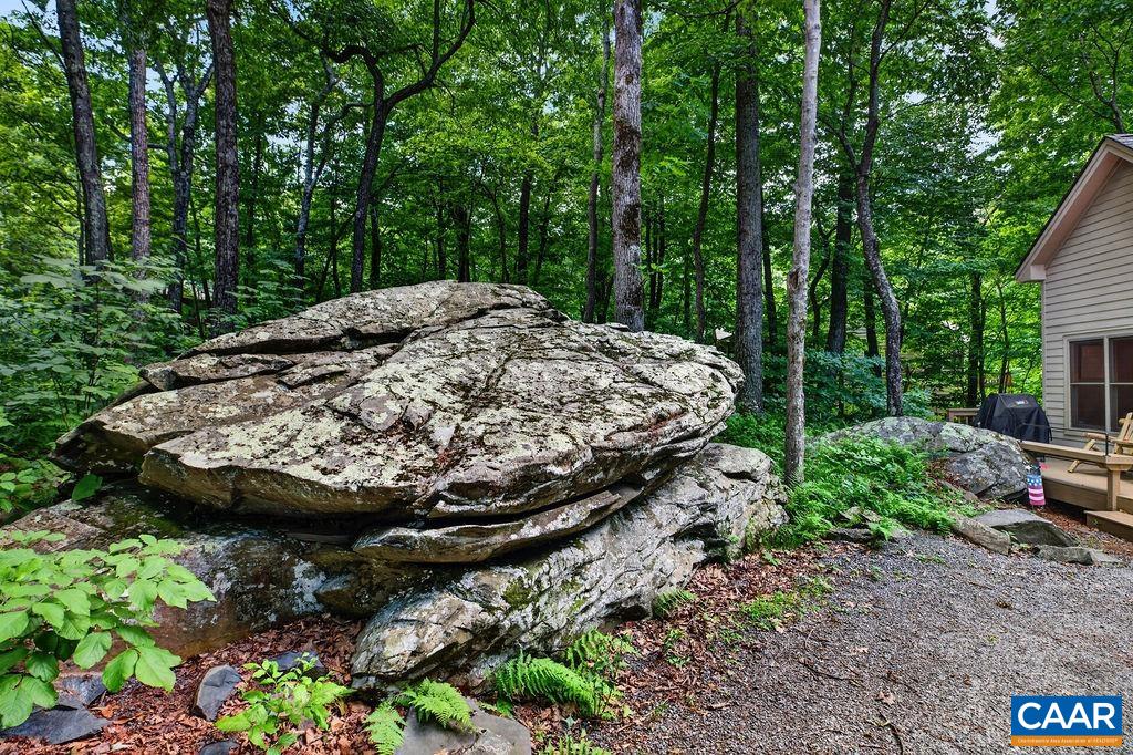 Rich in natural character, this homesite features a picturesque wooded setting with striking rock formations and a wonderful sense of privacy.