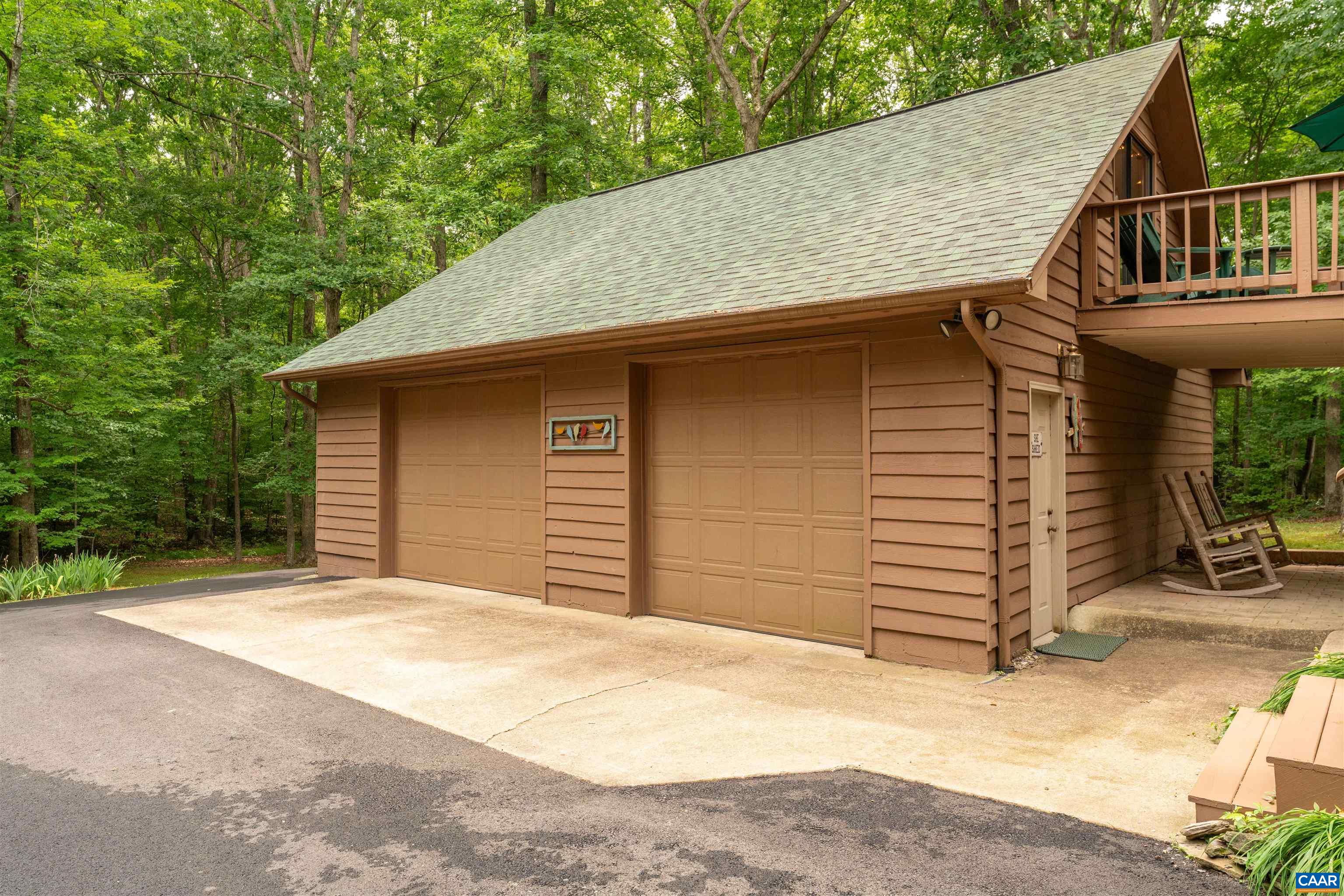 Holds 2 cars, a golf cart and more. Has a work bench area!