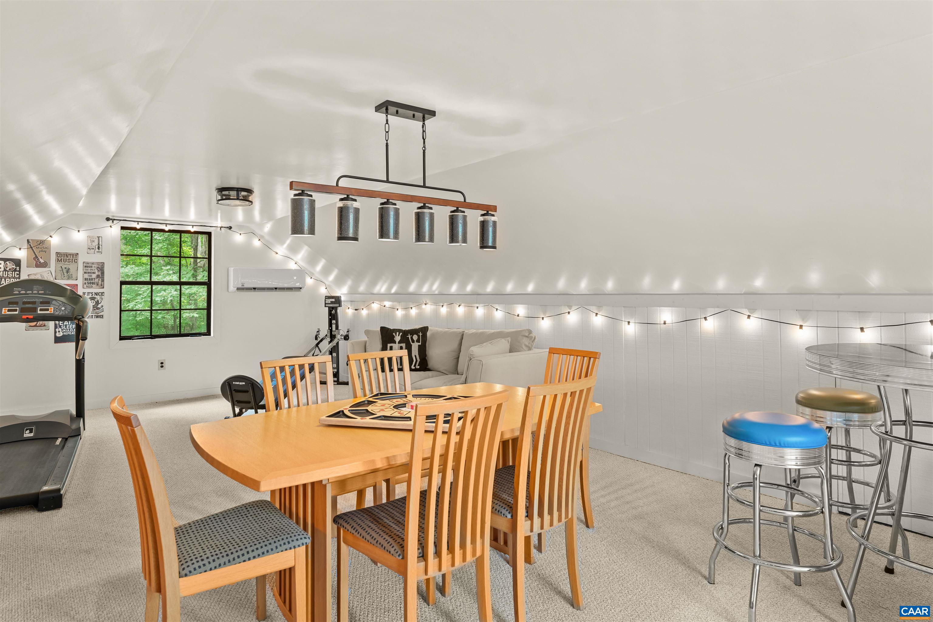 This loft is an amazing space. Two access points with stairs leading to the garage from inside and to the deck walkway.