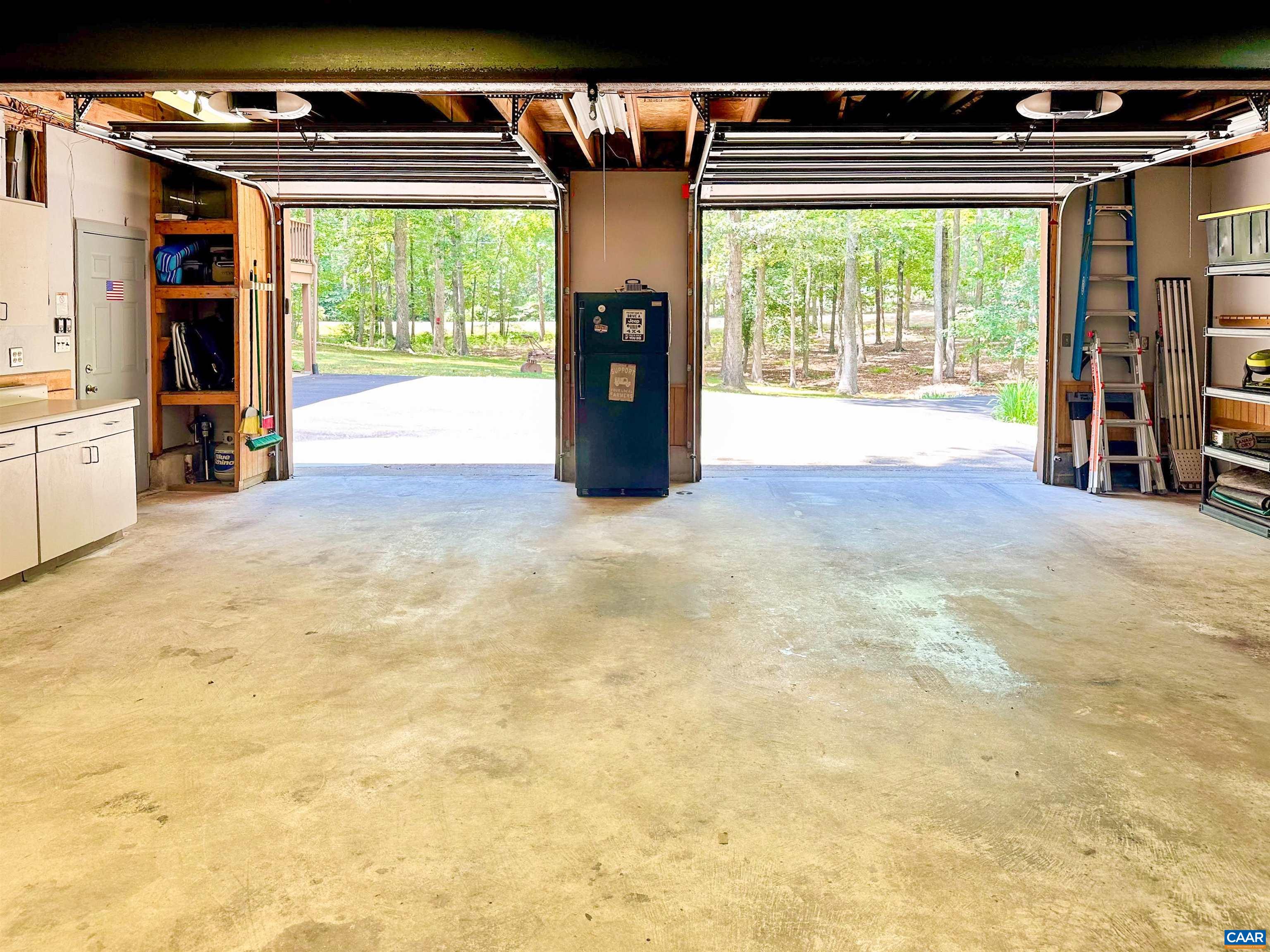 Two cars or truck, a golf cart, and a skidoo with room to spare