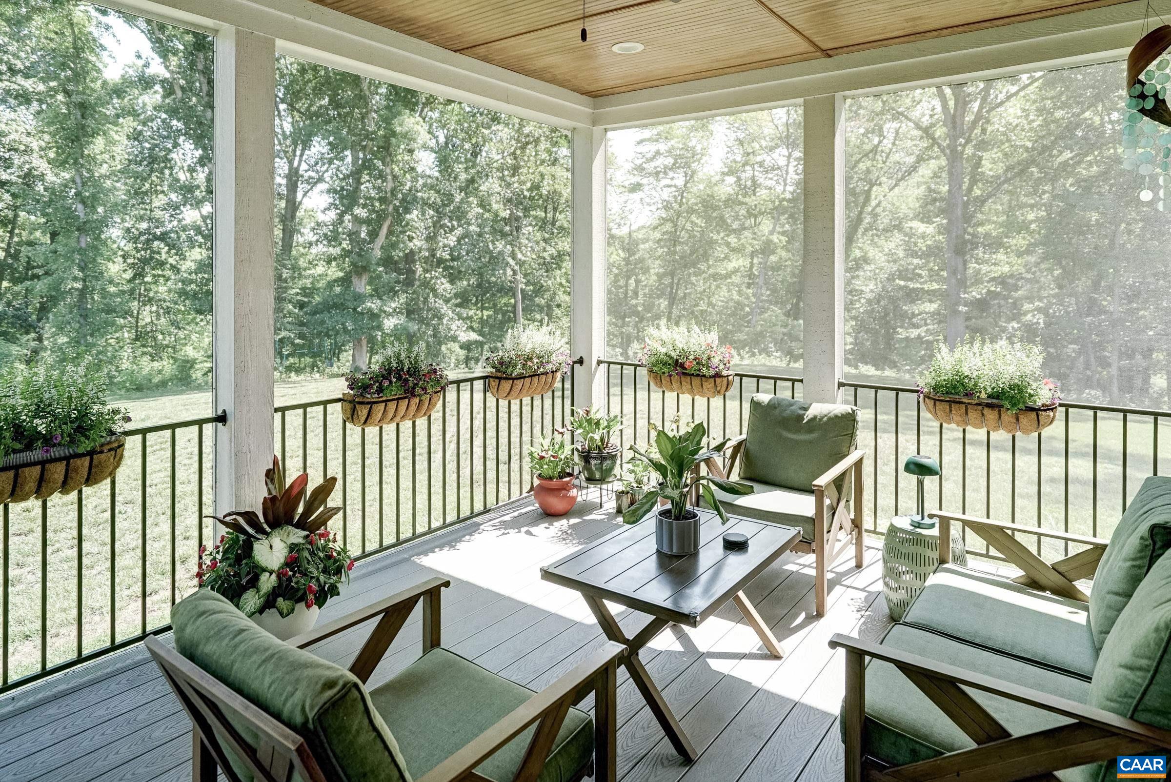 Screened porch with composite decking for outdoor living.