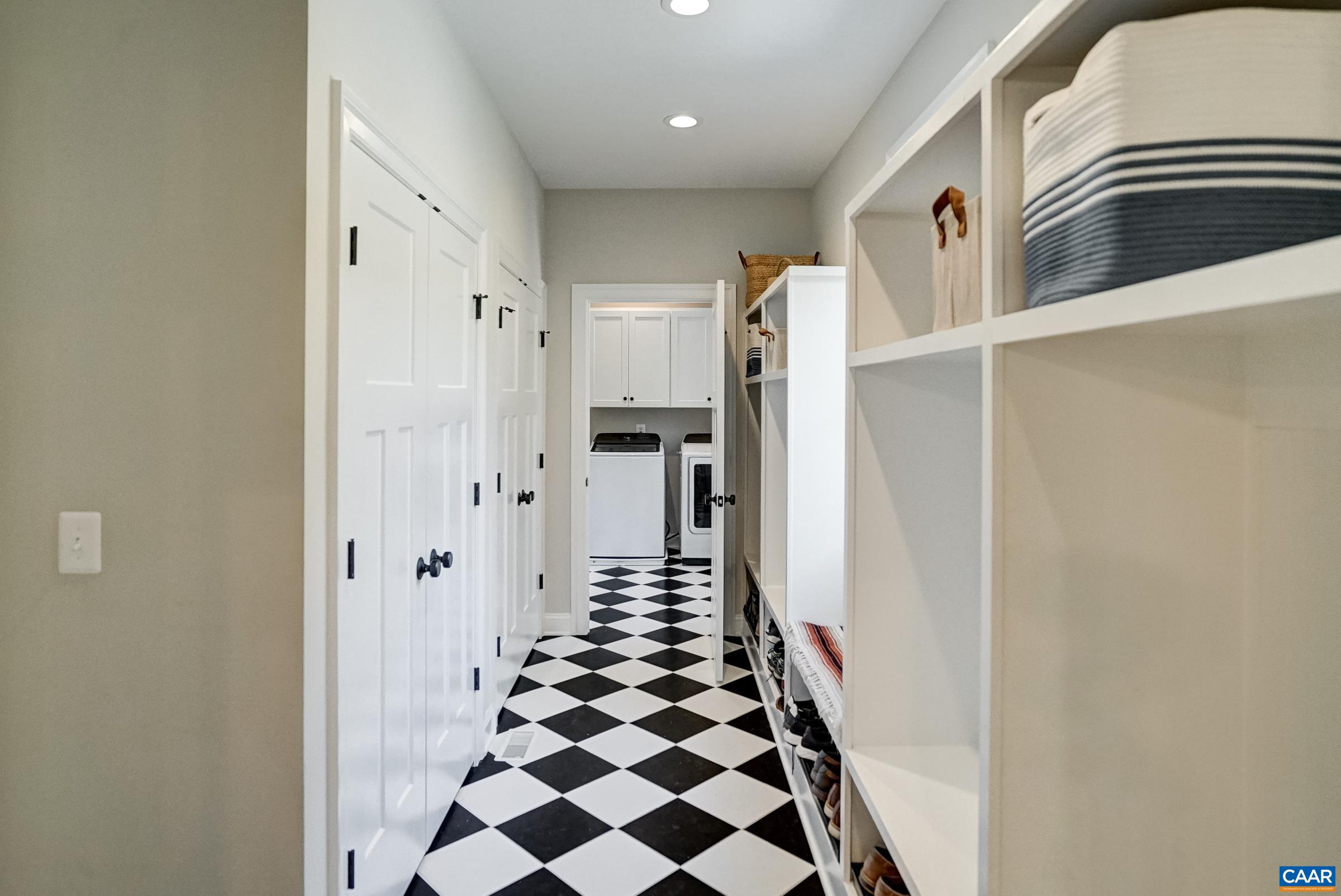 Mudroom features built-in cubbies and two large storage closets.