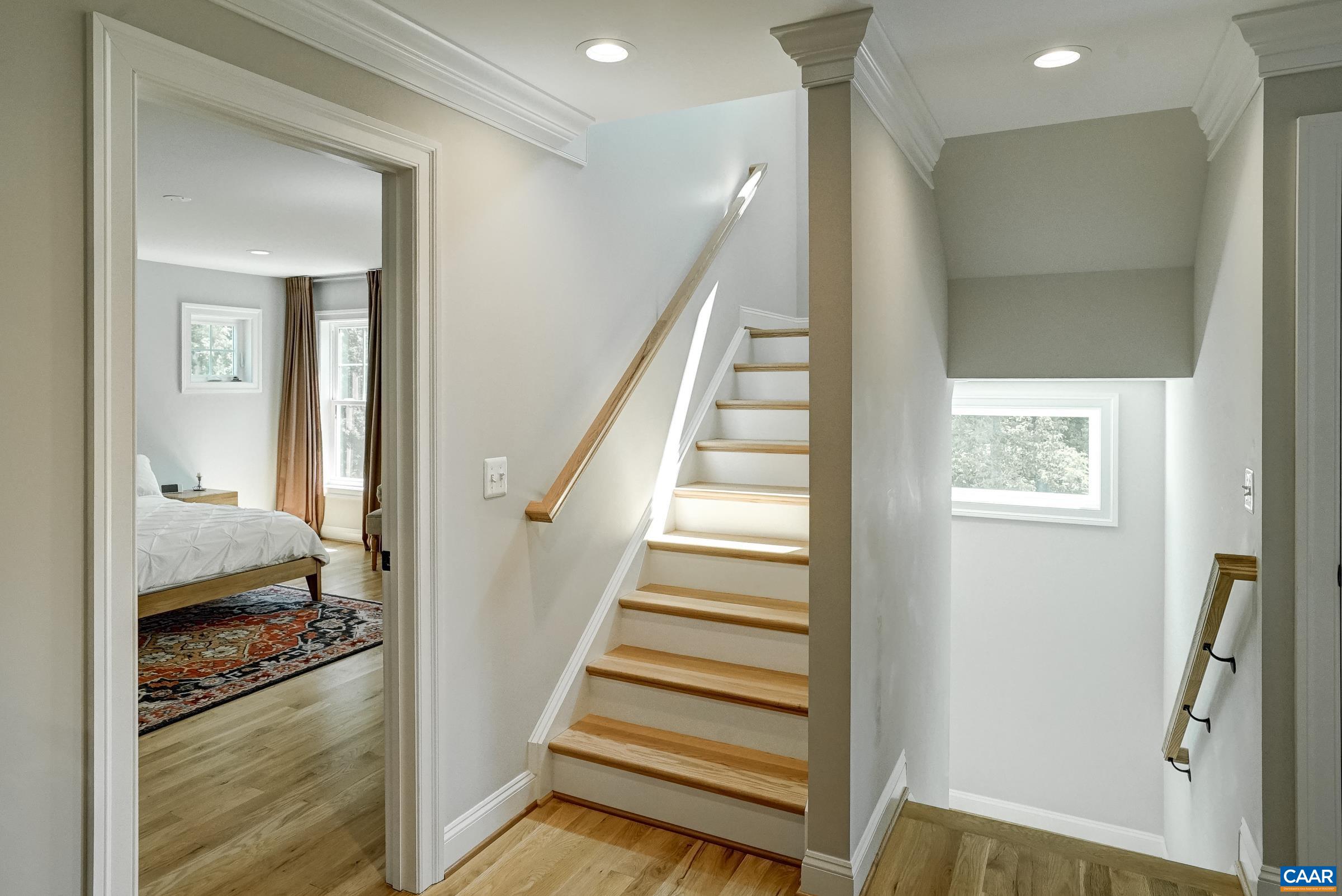 Hardwood floors continue across all three levels of the home.