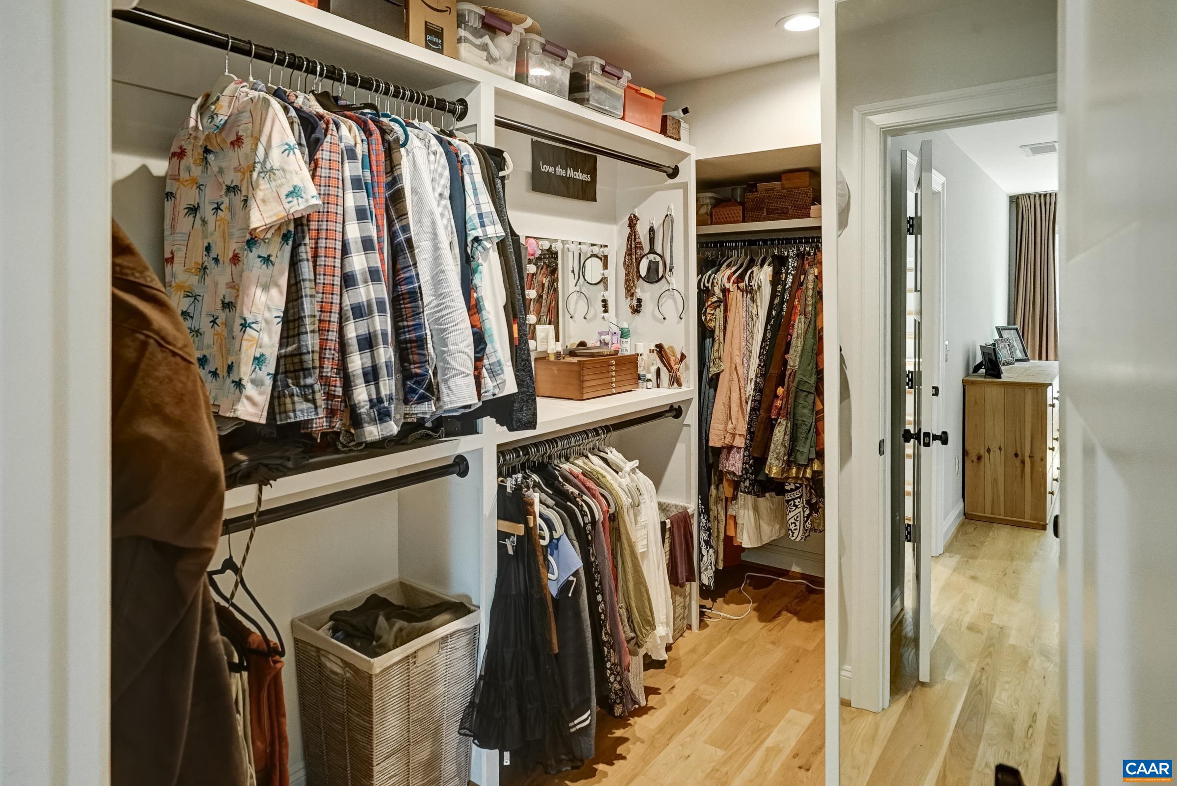 Custom designed walk-in closet with built-in storage.