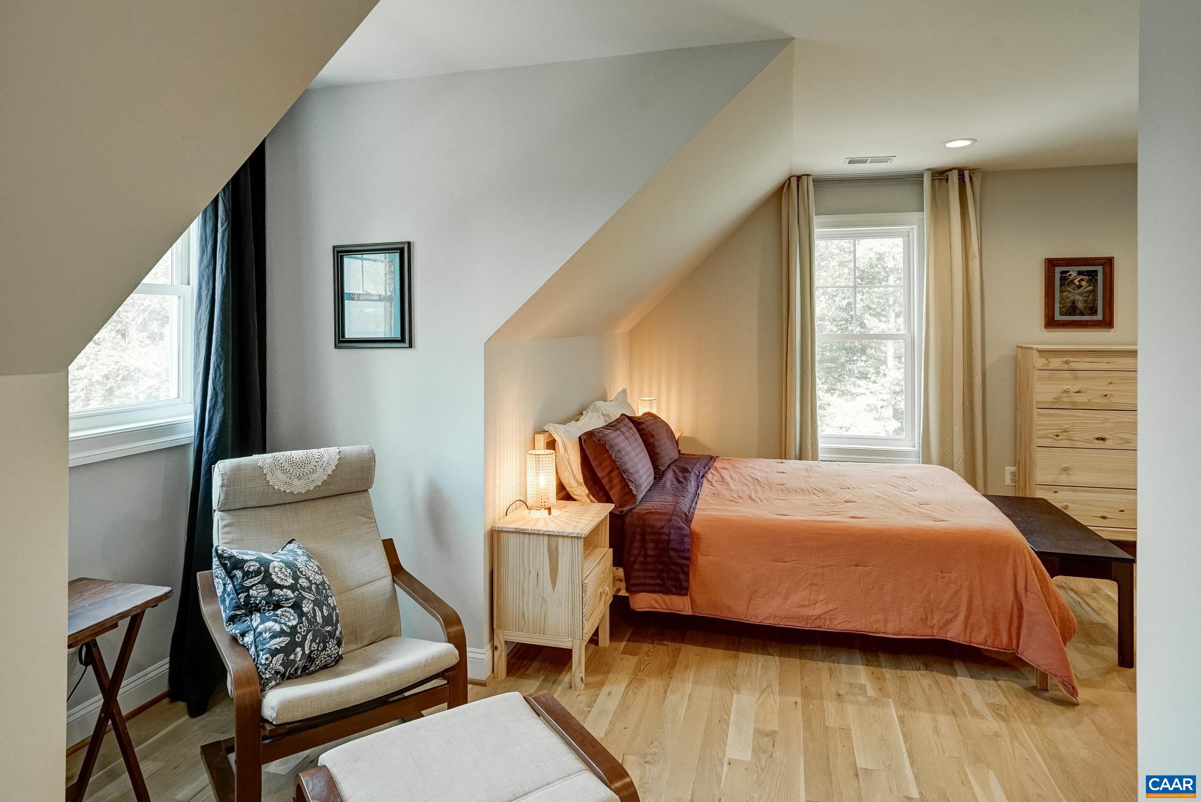 Bedroom 4 on the second floor features space for crafting or sitting area, ensuite bathroom and huge walk-in closet.