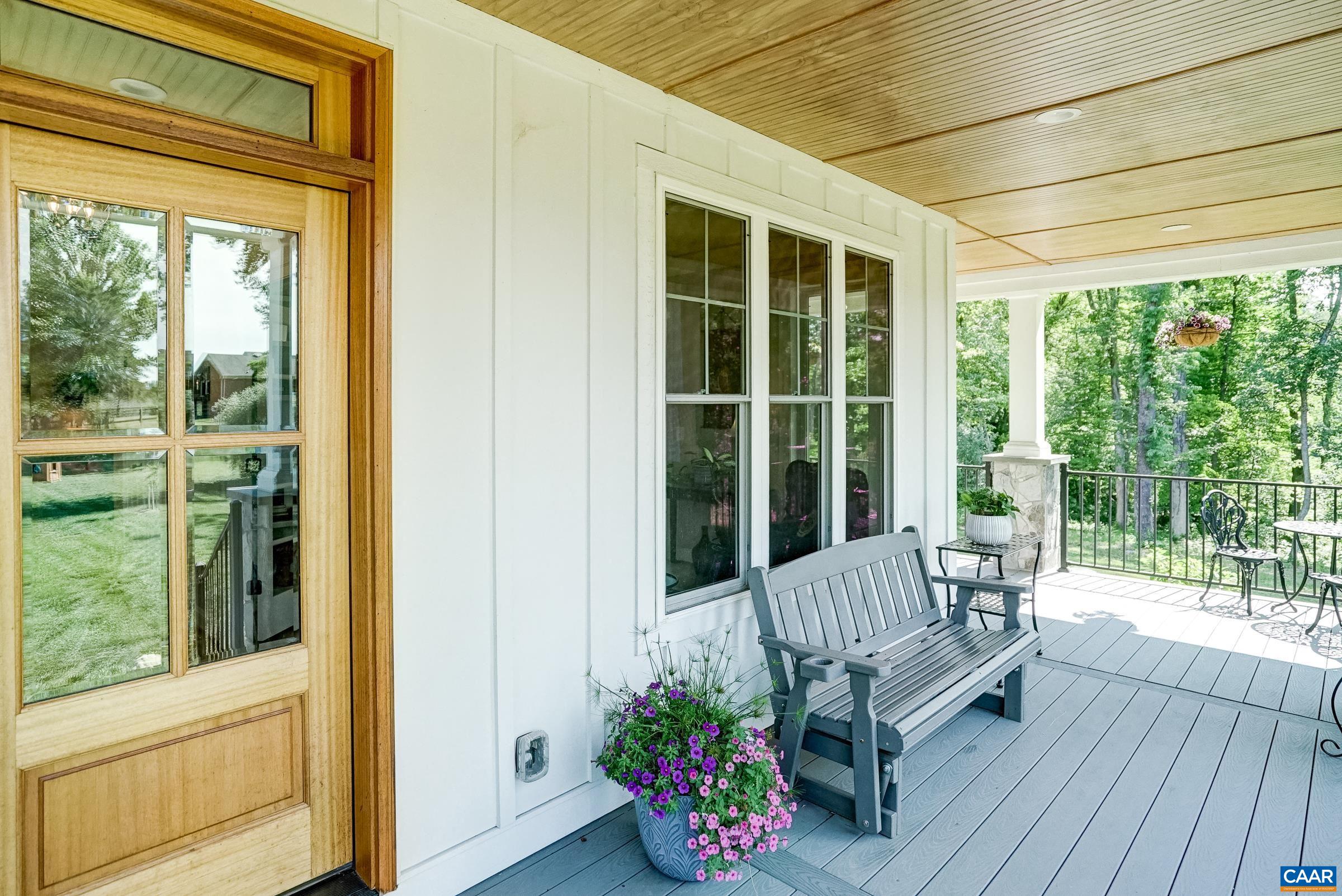 Wrap around covered porch with composite decking.