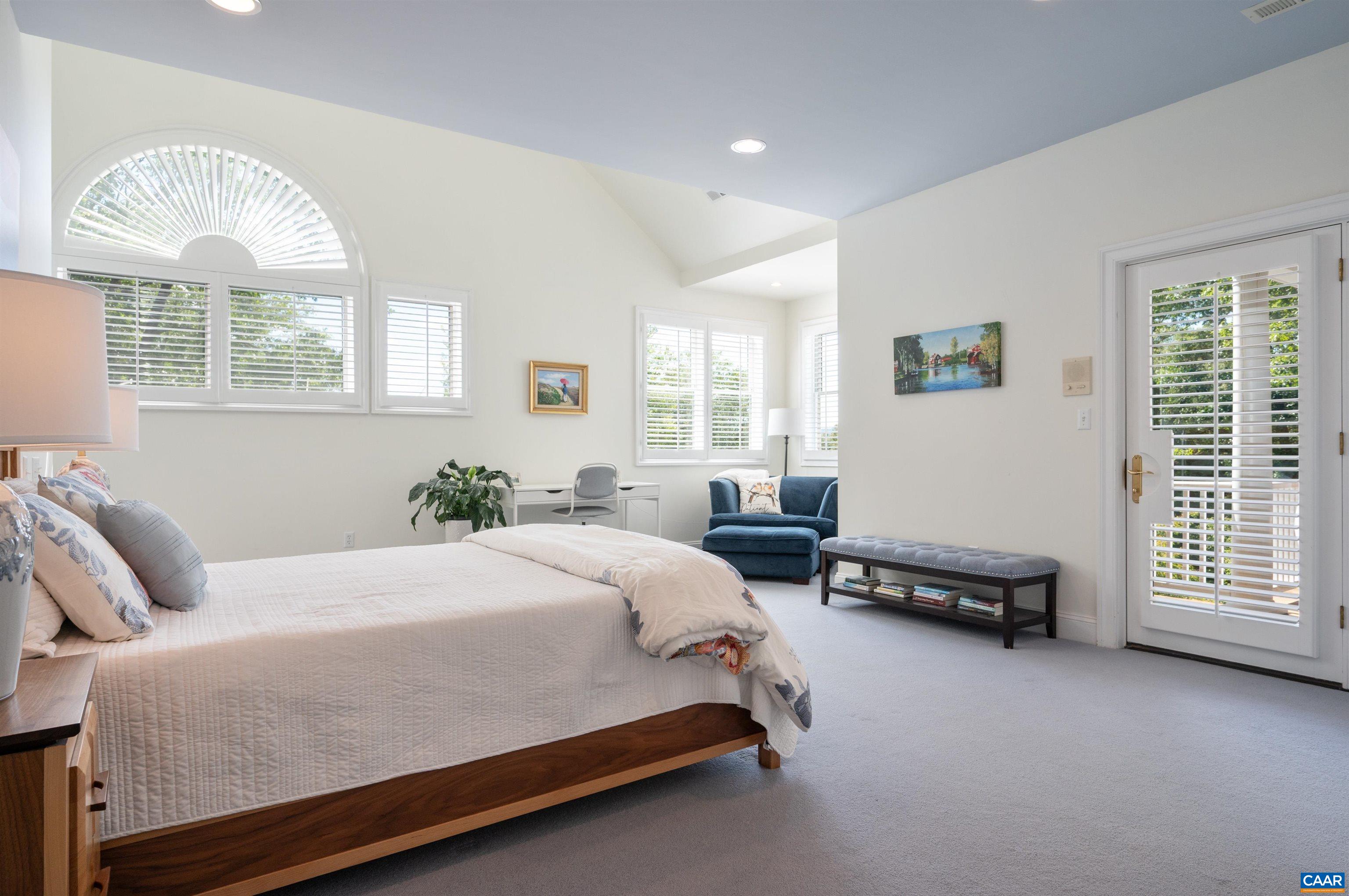 Enormous primary suite bathed in natural sunlight. Access to your private balcony