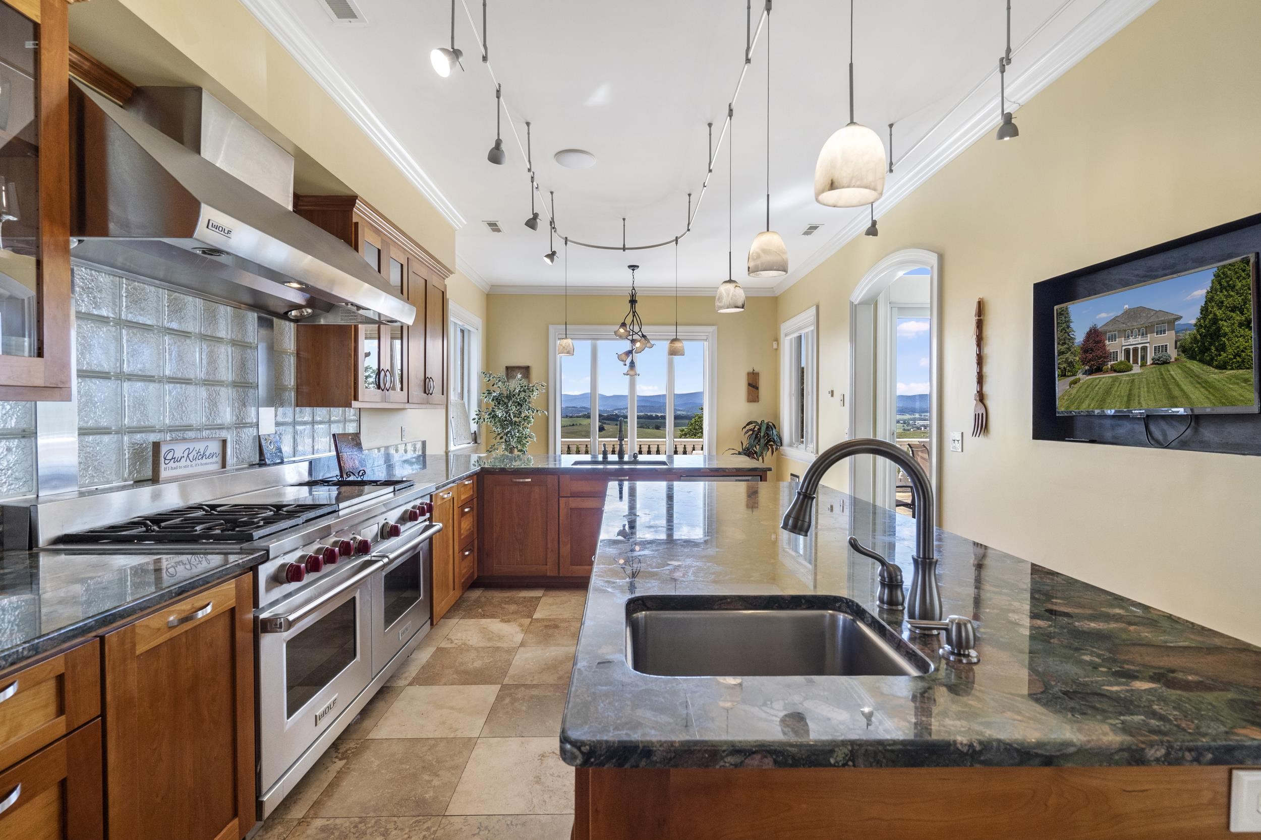 Wide and deep drawers were designed to easily access cooking items, making it a joy to prepare meals. The prep sink and counter space has room for multiple people in the kitchen. Enjoy the view or watch TV which is recessed in the wall Wide and deep drawers were designed to easily access cooking items, making it a joy to prepare meals. The prep sink and counter space has room for multiple people in the kitchen. Enjoy the view or watch TV which is recessed in the wall