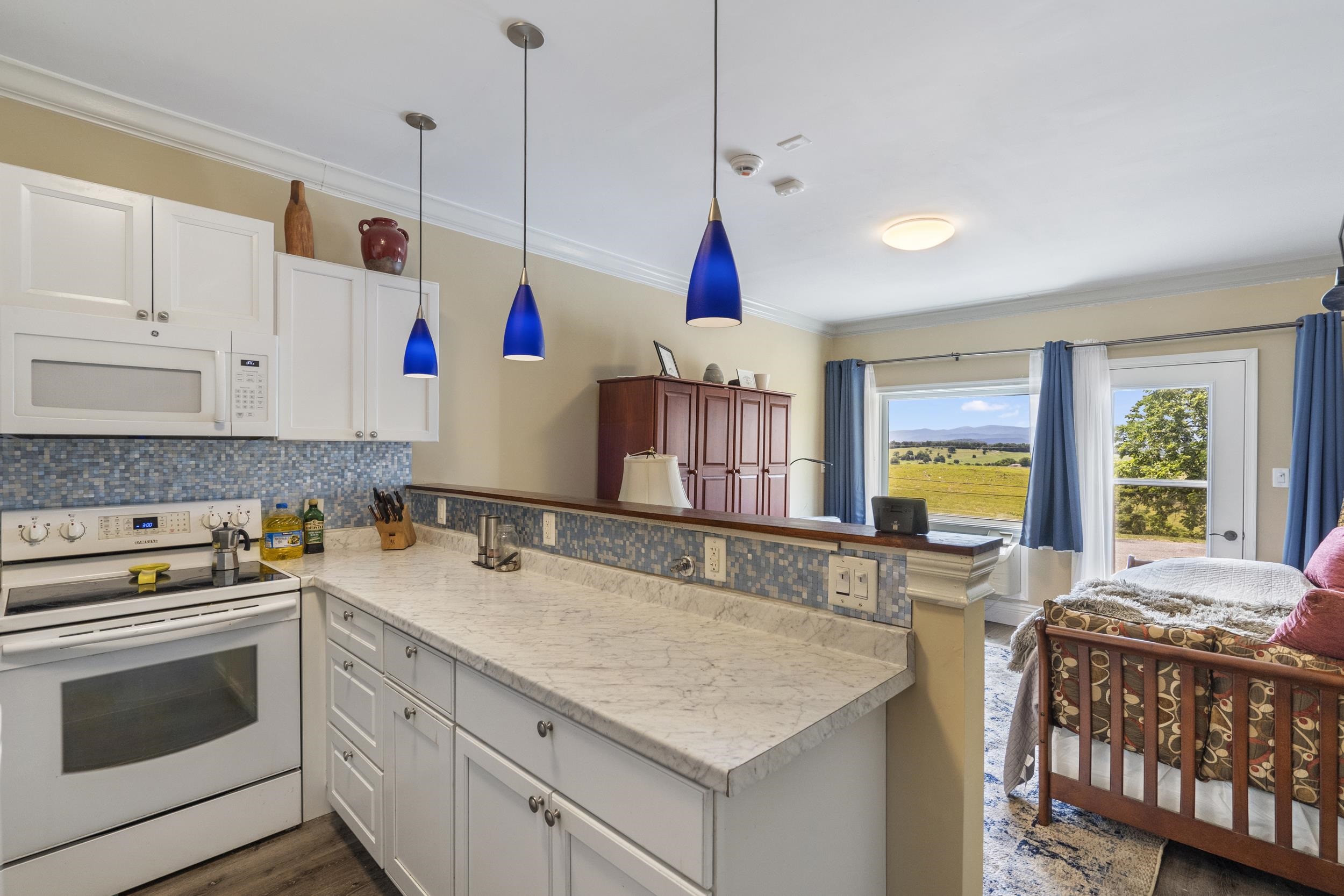 Enjoy the view while cooking or watch TV. Open floor plan studio apartment Enjoy the view while cooking or watch TV. Open floor plan studio apartment
