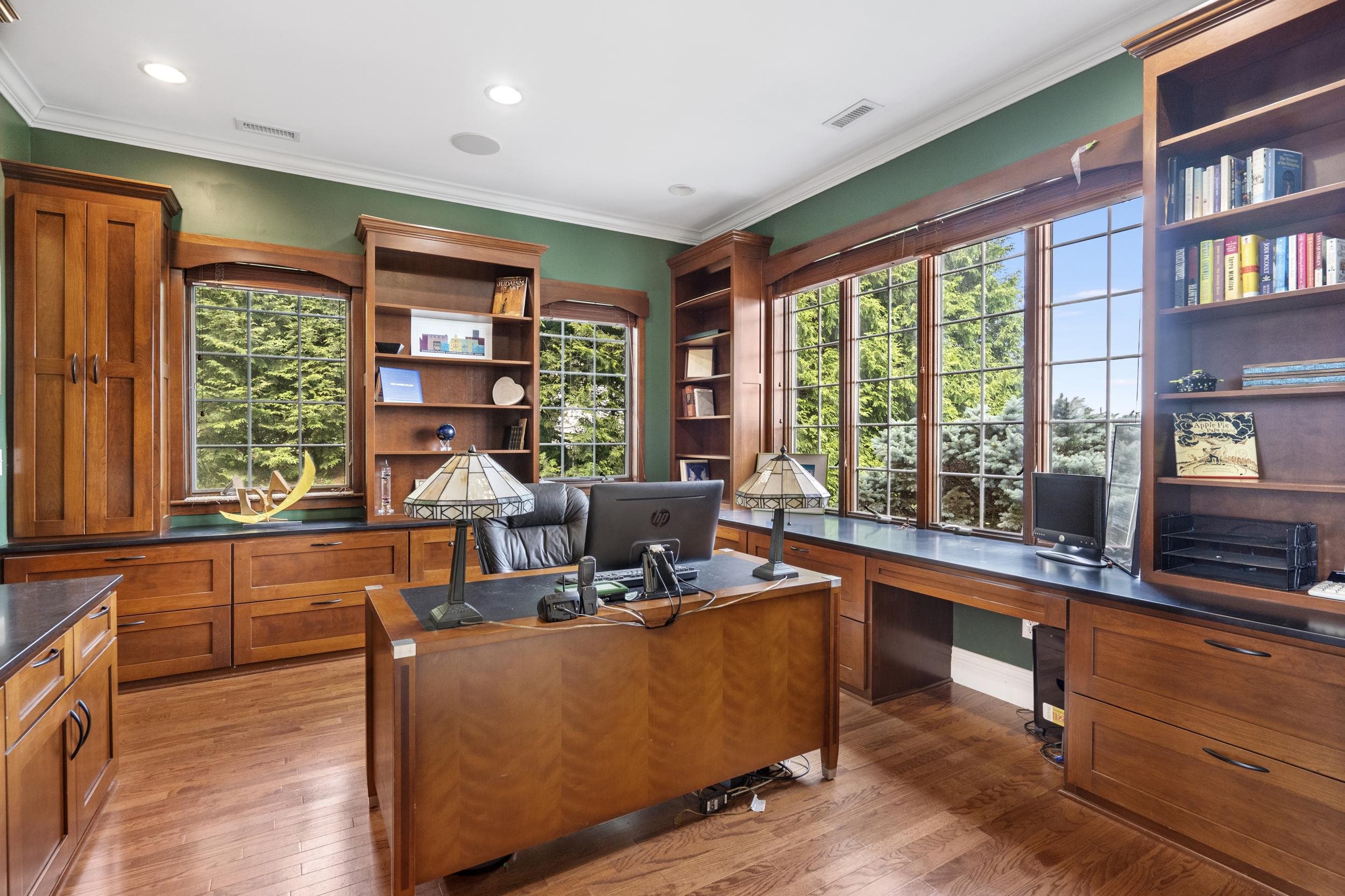 One could organize documents and get a lot of work done comfortably from your own home in this exectutives office. Wrapped with warm custom cherry cabinetry and a view from the window. PLUS, one could convert into Main level Primary Bedroom. Rm One could organize documents and get a lot of work done comfortably from your own home in this exectutives office. Wrapped with warm custom cherry cabinetry and a view from the window. PLUS, one could convert into Main level Primary Bedroom. Rm