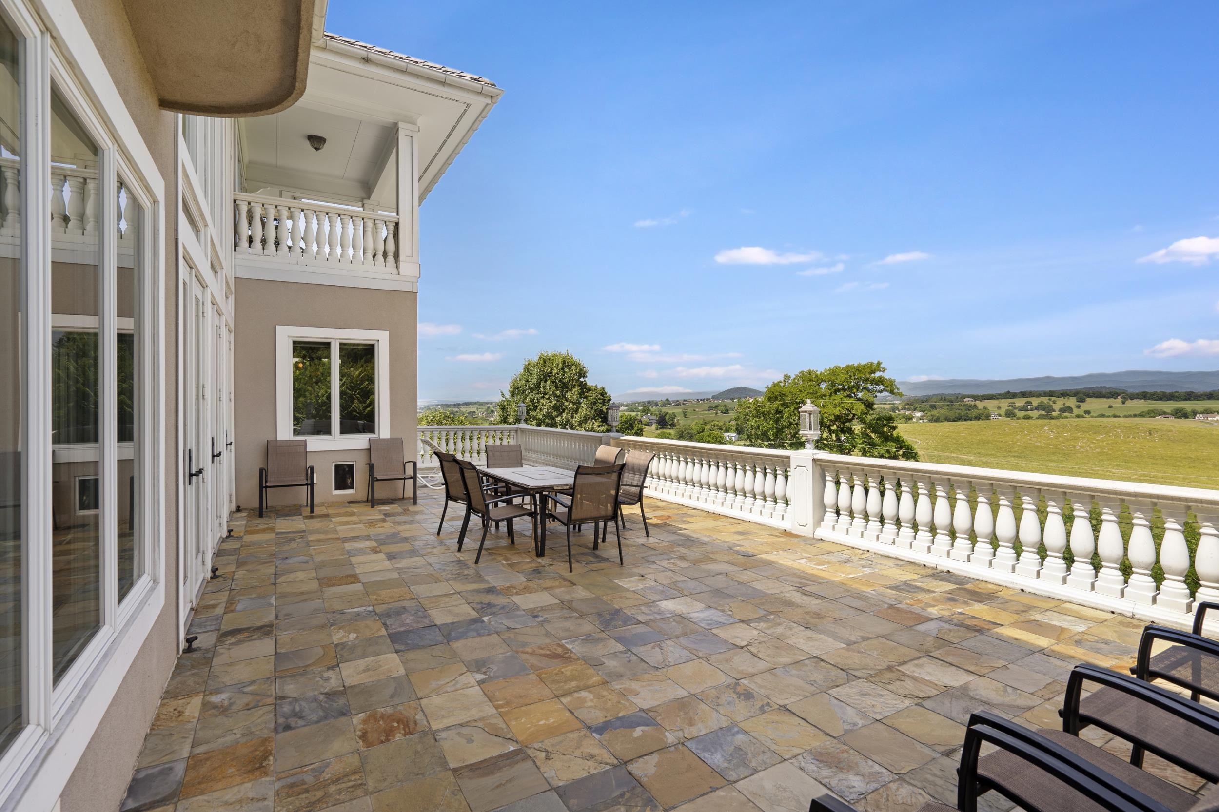This space is one of the many jewels of the estate. No words or pictures can convey the stunning mountain views. The pillars on the terrace and other porches were custom made in Harrisonburg at Harpers. Great space for entertaininng. This space is one of the many jewels of the estate. No words or pictures can convey the stunning mountain views. The pillars on the terrace and other porches were custom made in Harrisonburg at Harpers. Great space for entertaininng.