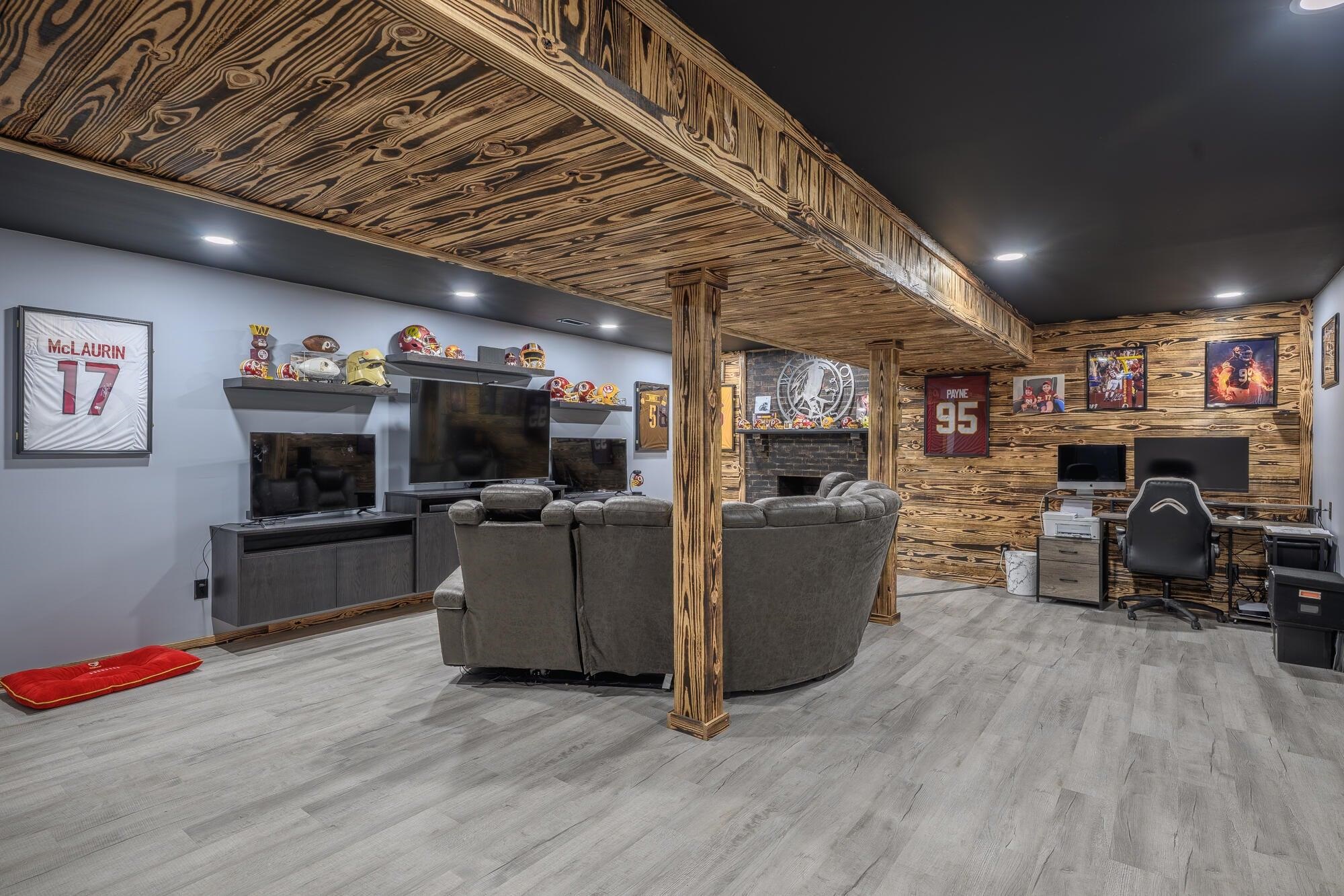 The partially finished lower level provides flexible space, ideal for additional guest accommodations or expanded rental use.