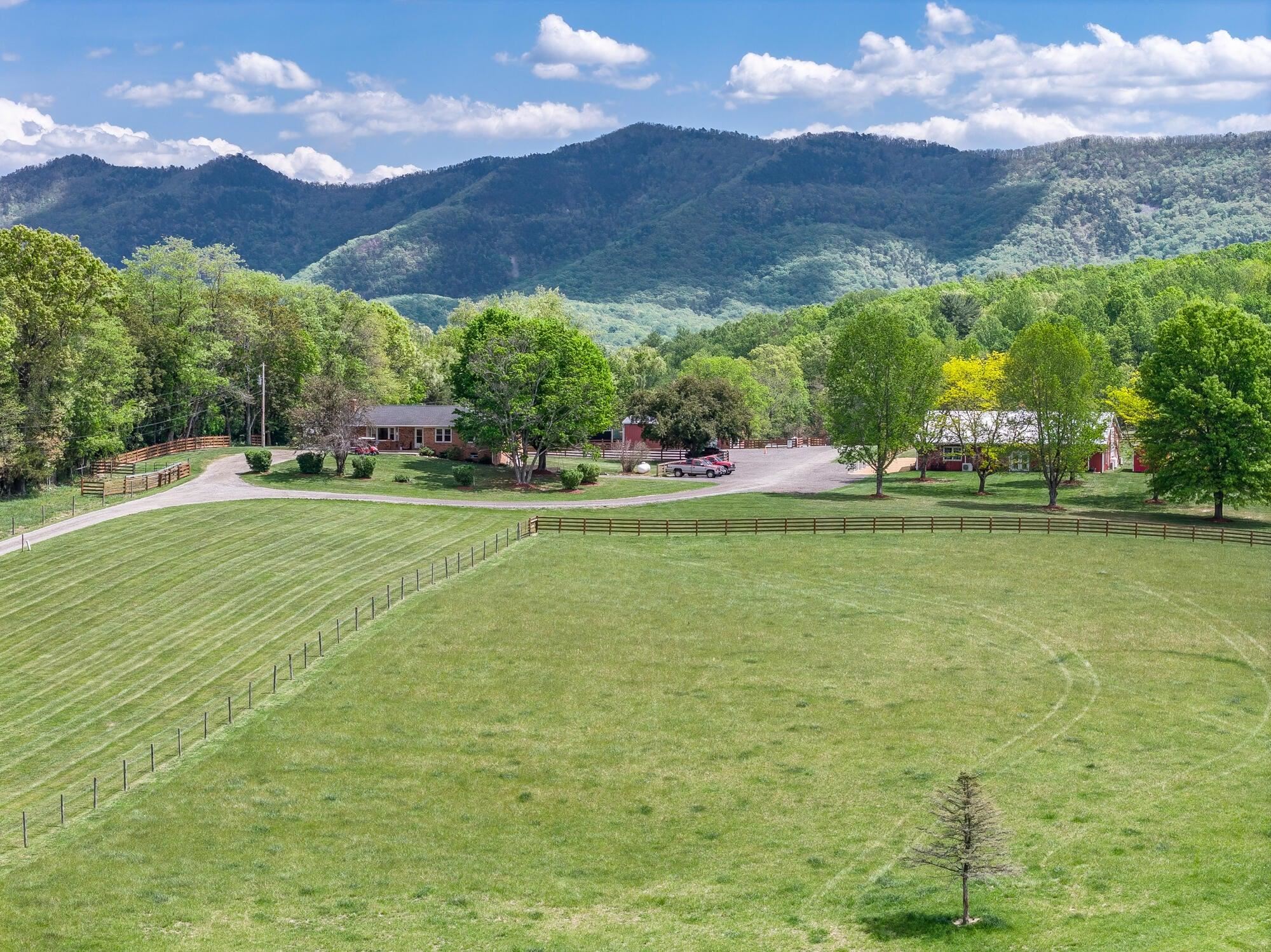 Featuring two homes, an approximately 4,500 sq ft event space, plus additional barns and outbuildings for storage and operations.
