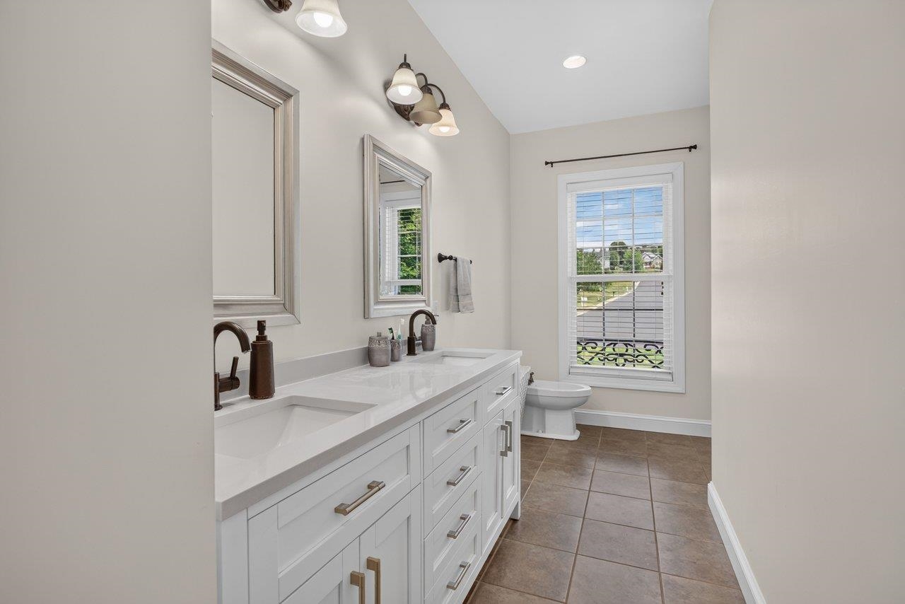 *double sinks *white cabinets *bidet *tub/shower combo *tile floors
