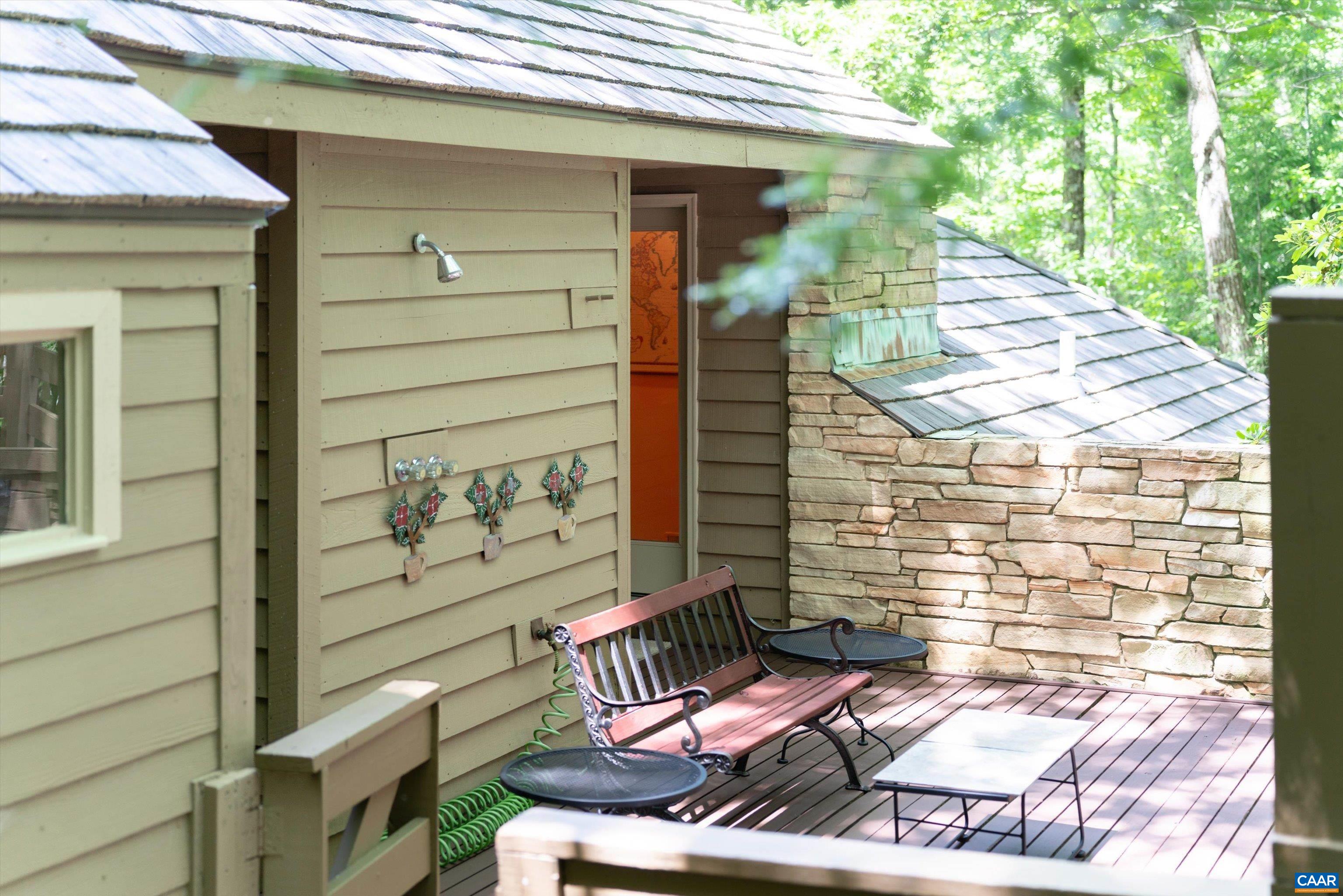 Main level deck near sauna. Note outside shower. Main level deck near sauna. Note outside shower.