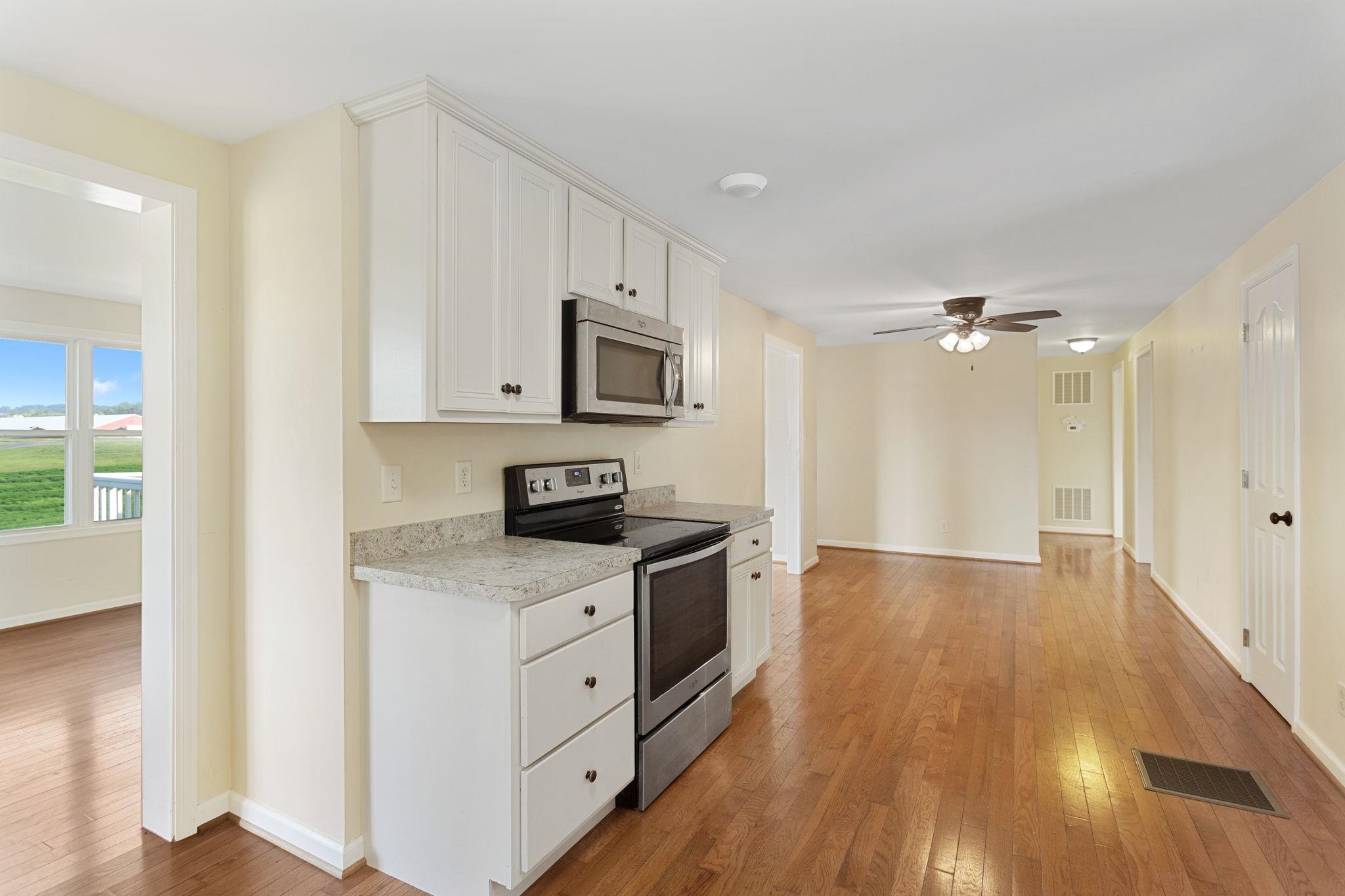 with cased in door to living room with views.