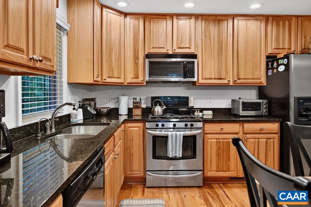 The beautiful kitchen features granite counter tops, maple cabinets, a pantry and a gas range. The beautiful kitchen features granite counter tops, maple cabinets, a pantry and a gas range.