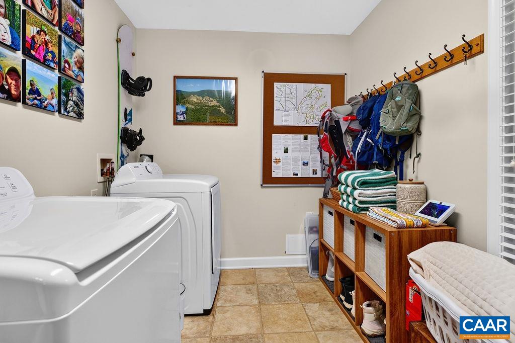 A spacious mudroom/laundry room just off the foyer includes a utility sink and provides excellent everyday functionality. A spacious mudroom/laundry room just off the foyer includes a utility sink and provides excellent everyday functionality.
