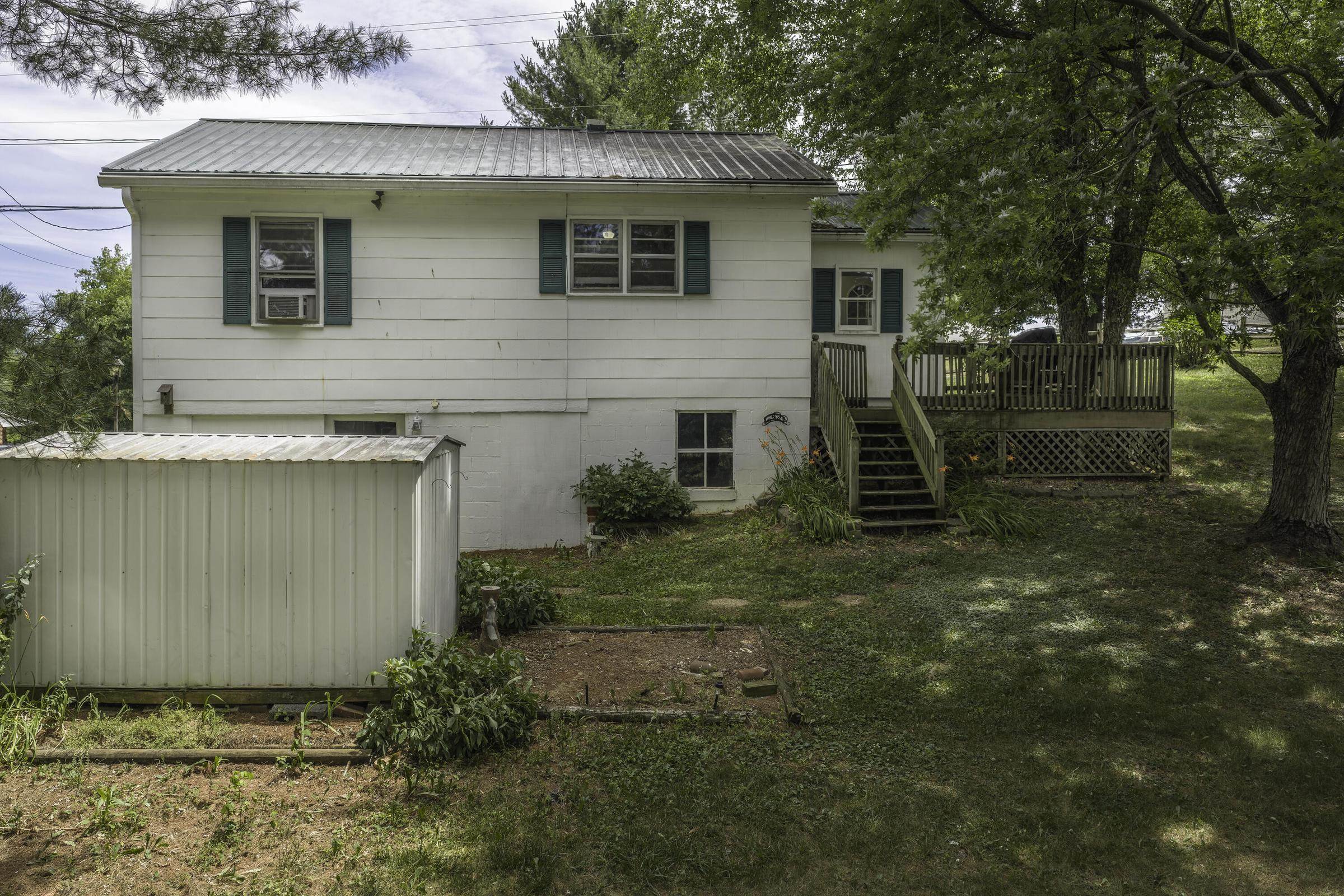 Situated .38 acres (+/-), the property offers ample outdoor space for gardening, flowers, vegetables, or simply enjoying the outdoors. Situated .38 acres (+/-), the property offers ample outdoor space for gardening, flowers, vegetables, or simply enjoying the outdoors.