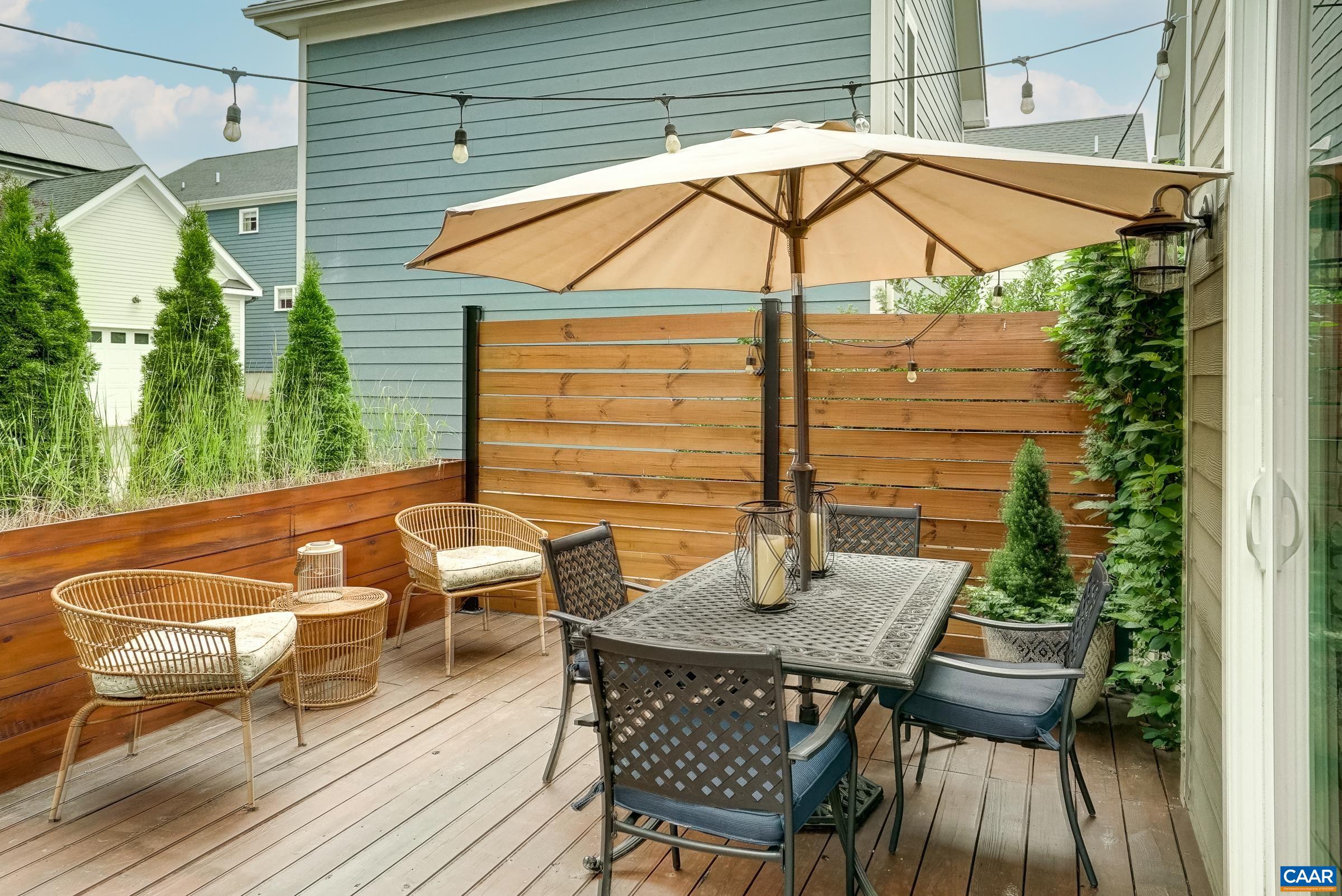 Dine or grill on the rear deck with privacy fence. Dine or grill on the rear deck with privacy fence.