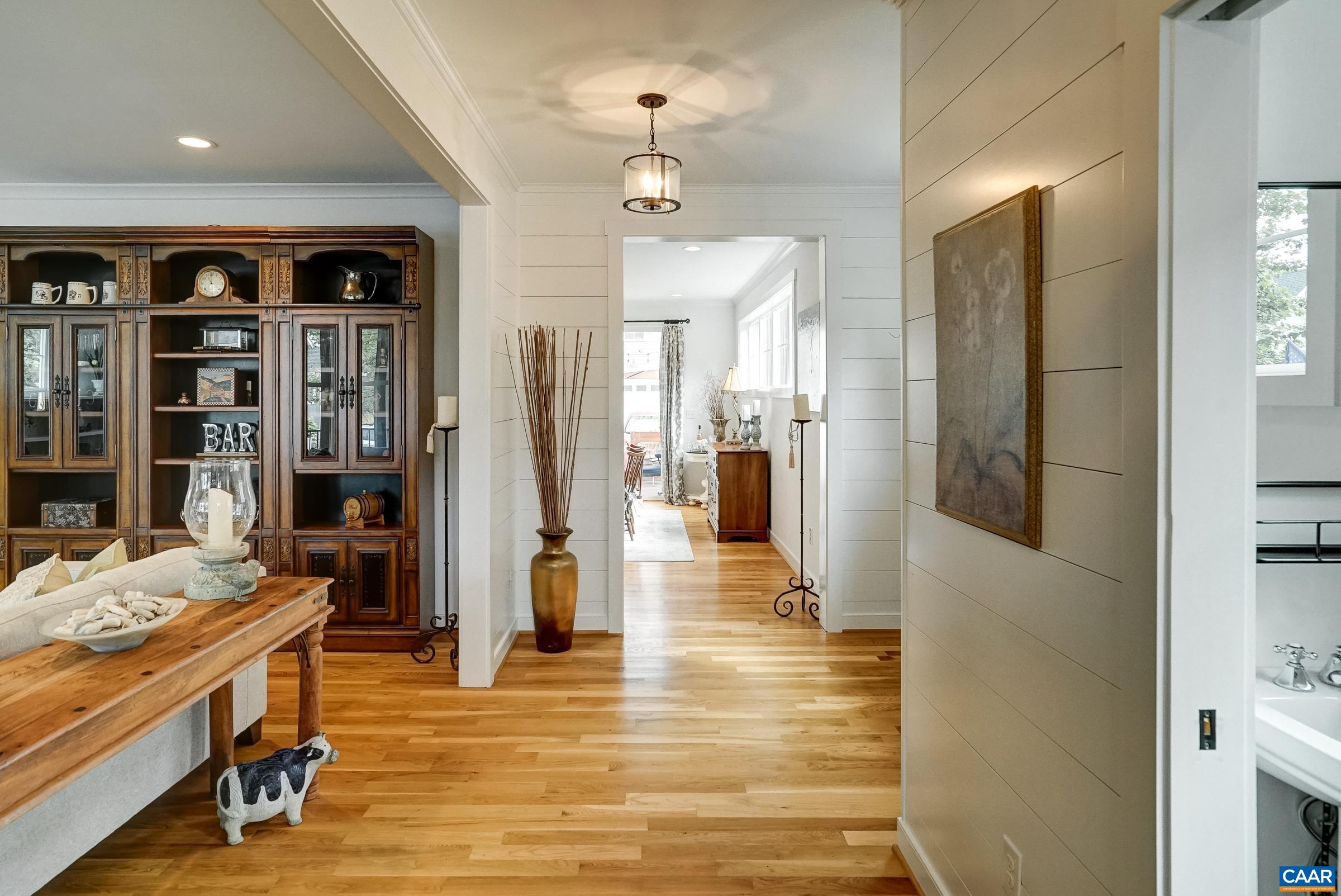 Shiplap walls throughout the foyer and living room. Shiplap walls throughout the foyer and living room.