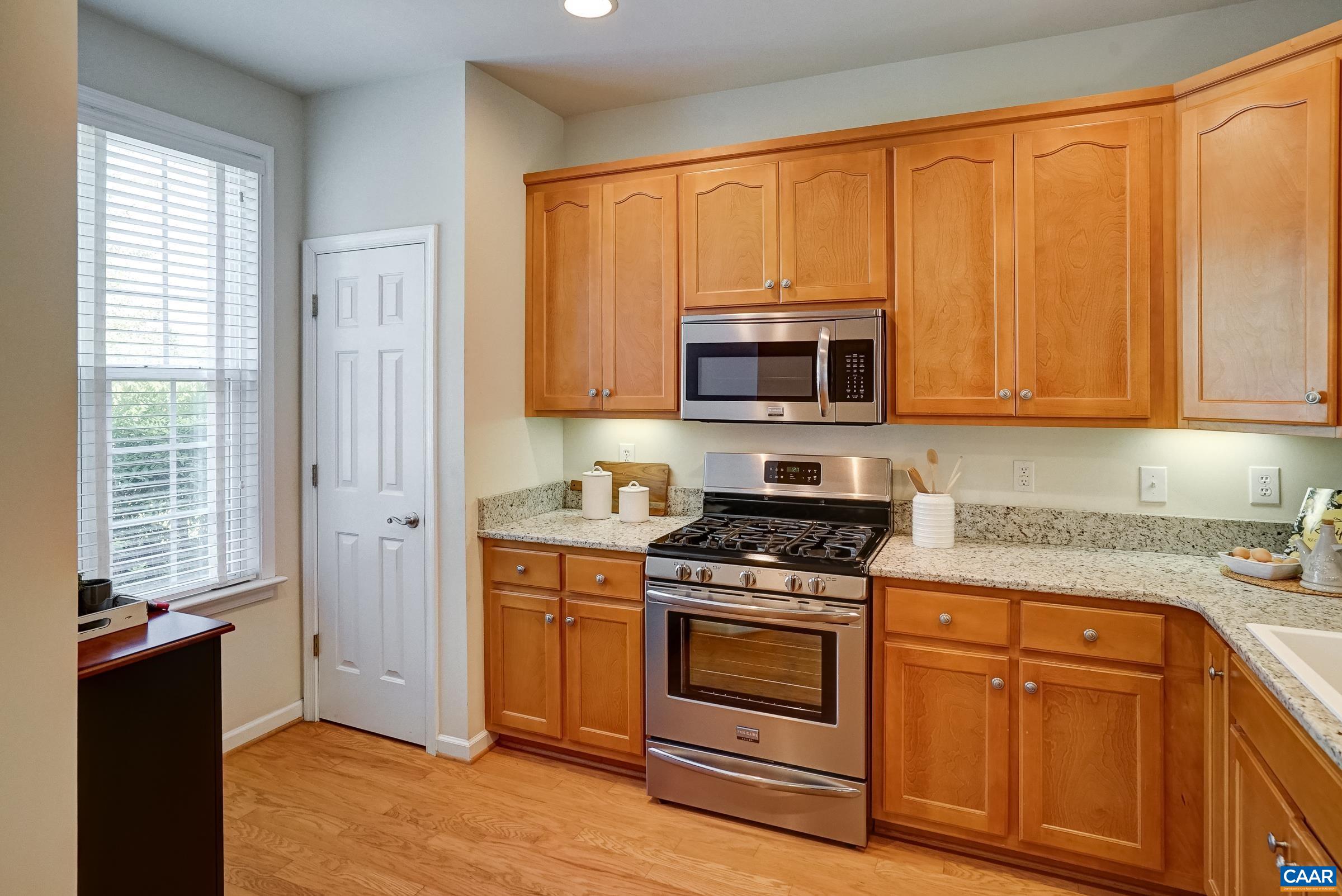 Updated kitchen features hardwood floors, granite countertops and maple cabinets. Updated kitchen features hardwood floors, granite countertops and maple cabinets.