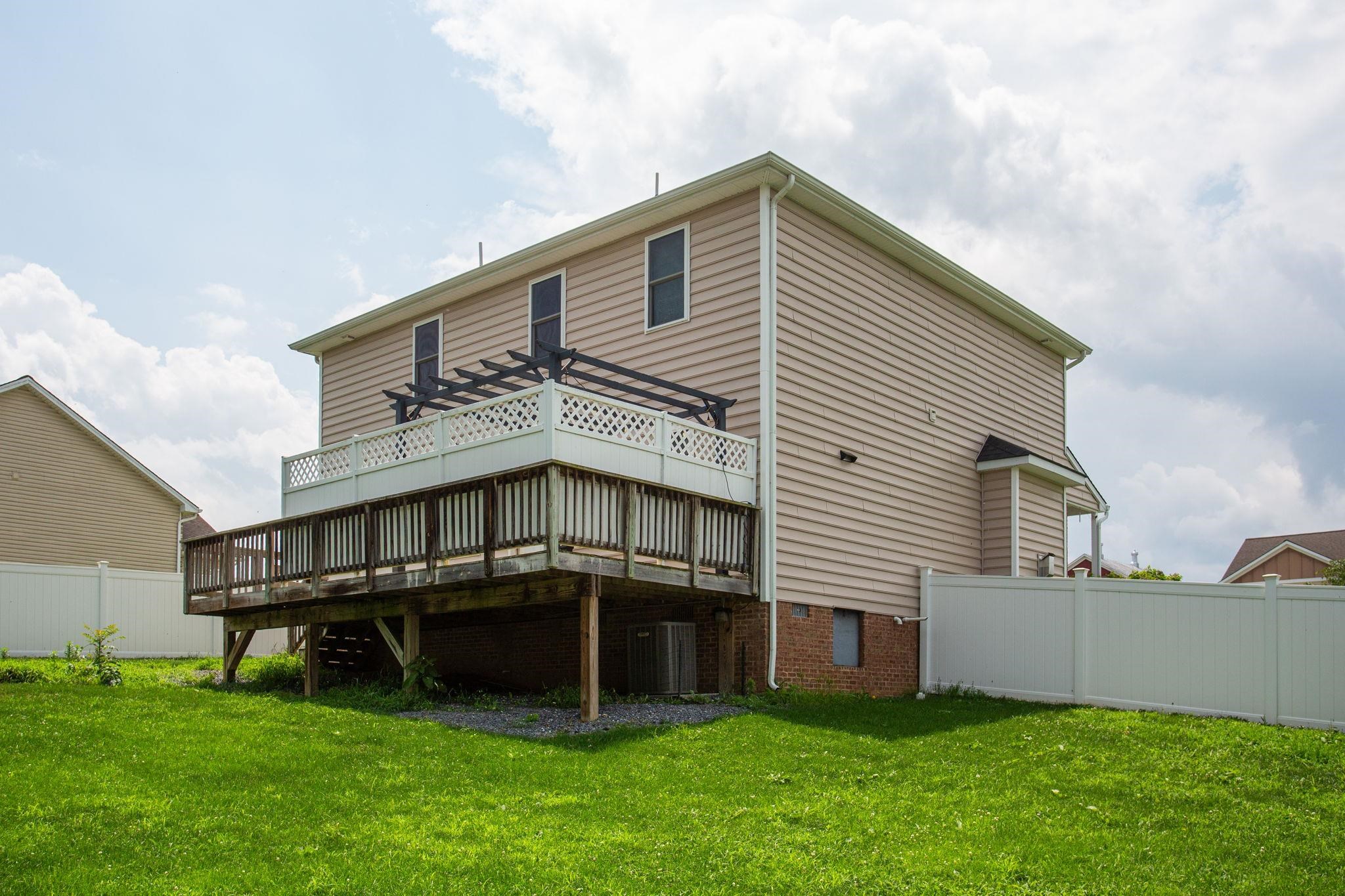 large rear deck with pergola and showing crawl space access. large rear deck with pergola and showing crawl space access.
