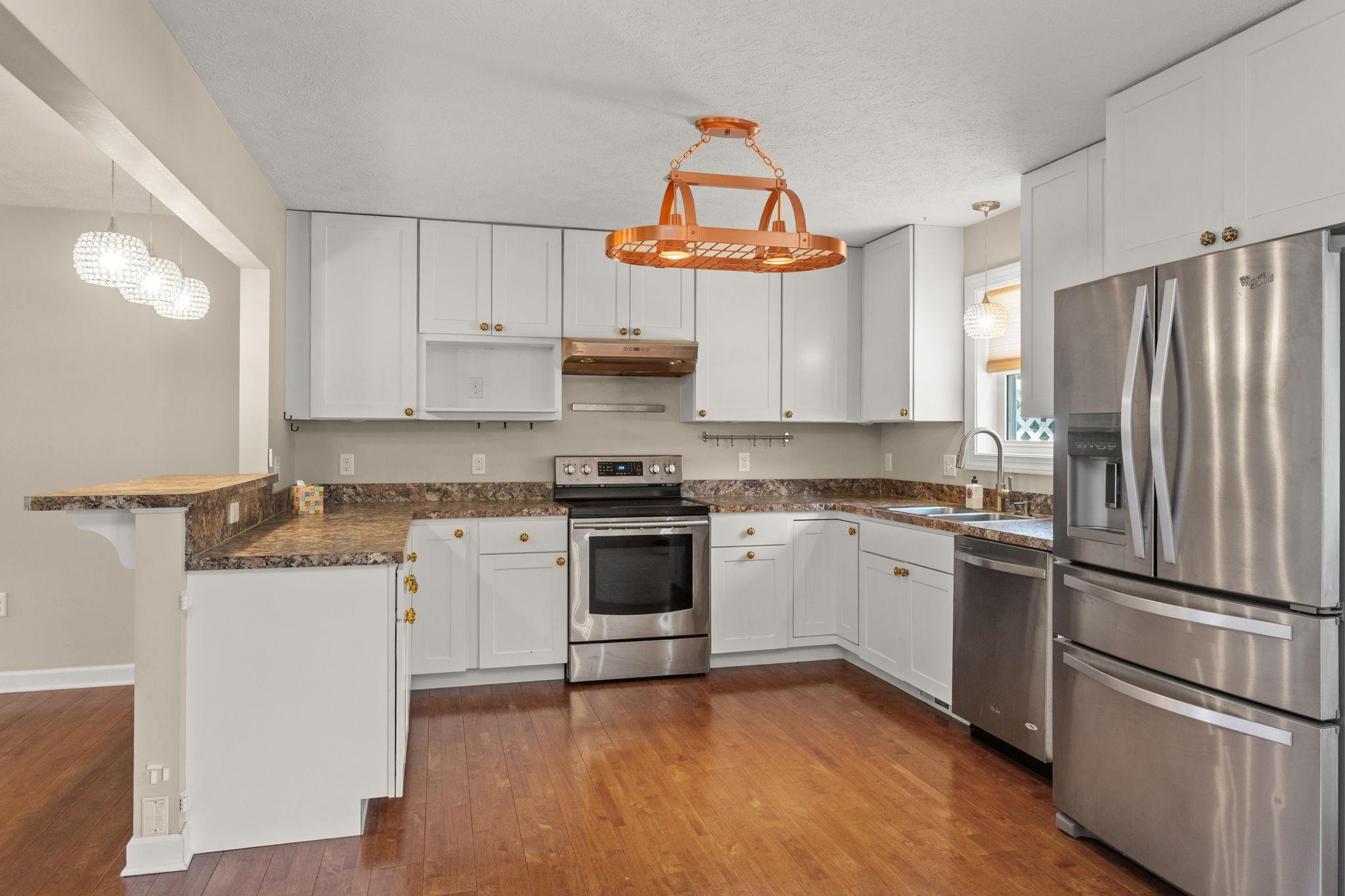 with stainless steel appliances and breakfast bar. with stainless steel appliances and breakfast bar.