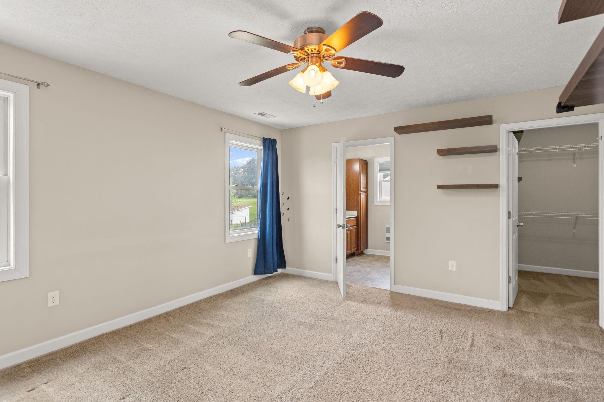 with walk-in closet with walk-in closet