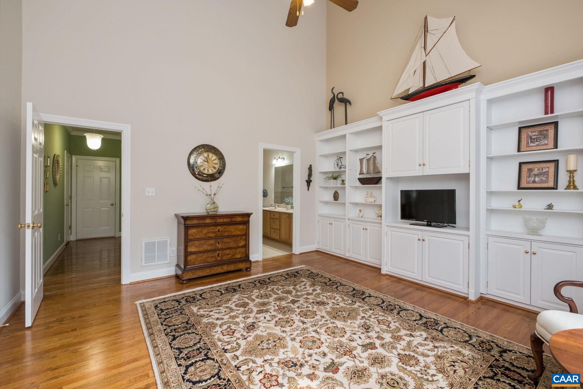 The primary closet is out of view, and the view is looking toward the primary bathroom. A second closet is in the bathroom. The primary closet is out of view, and the view is looking toward the primary bathroom. A second closet is in the bathroom.