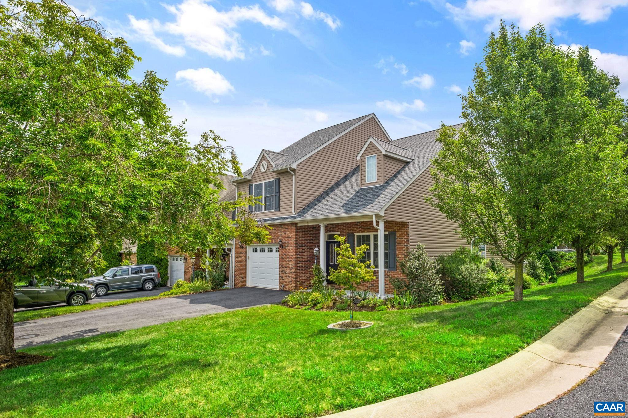 End unit townhome with new roof, covered front porch, and 1-car garage. End unit townhome with new roof, covered front porch, and 1-car garage.