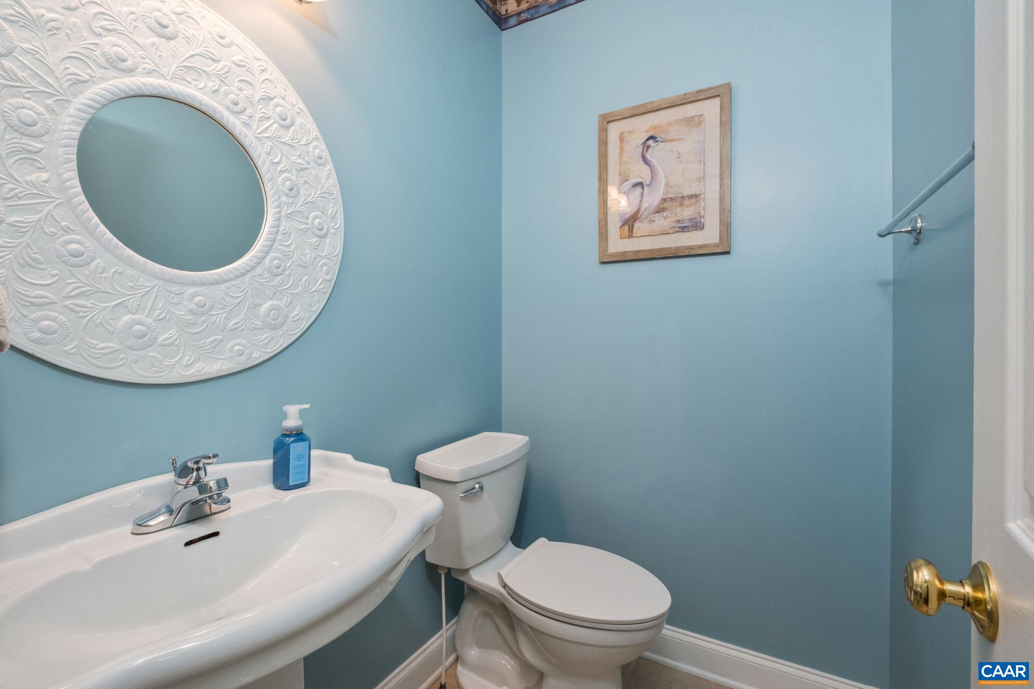 The half bath on the main level is just off of the garage. The half bath on the main level is just off of the garage.
