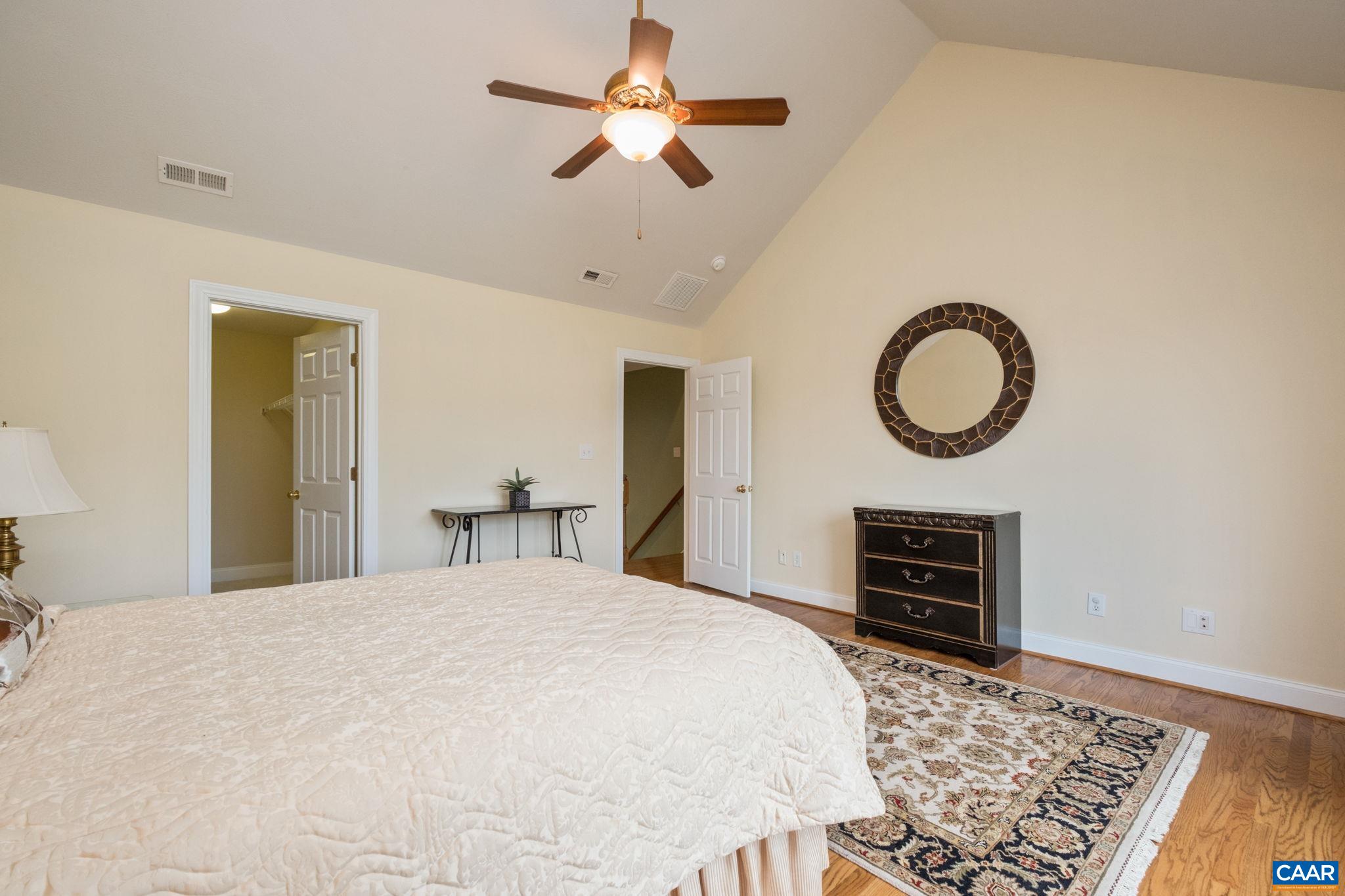 Featuring a vaulted ceiling and walk-in closet. Featuring a vaulted ceiling and walk-in closet.