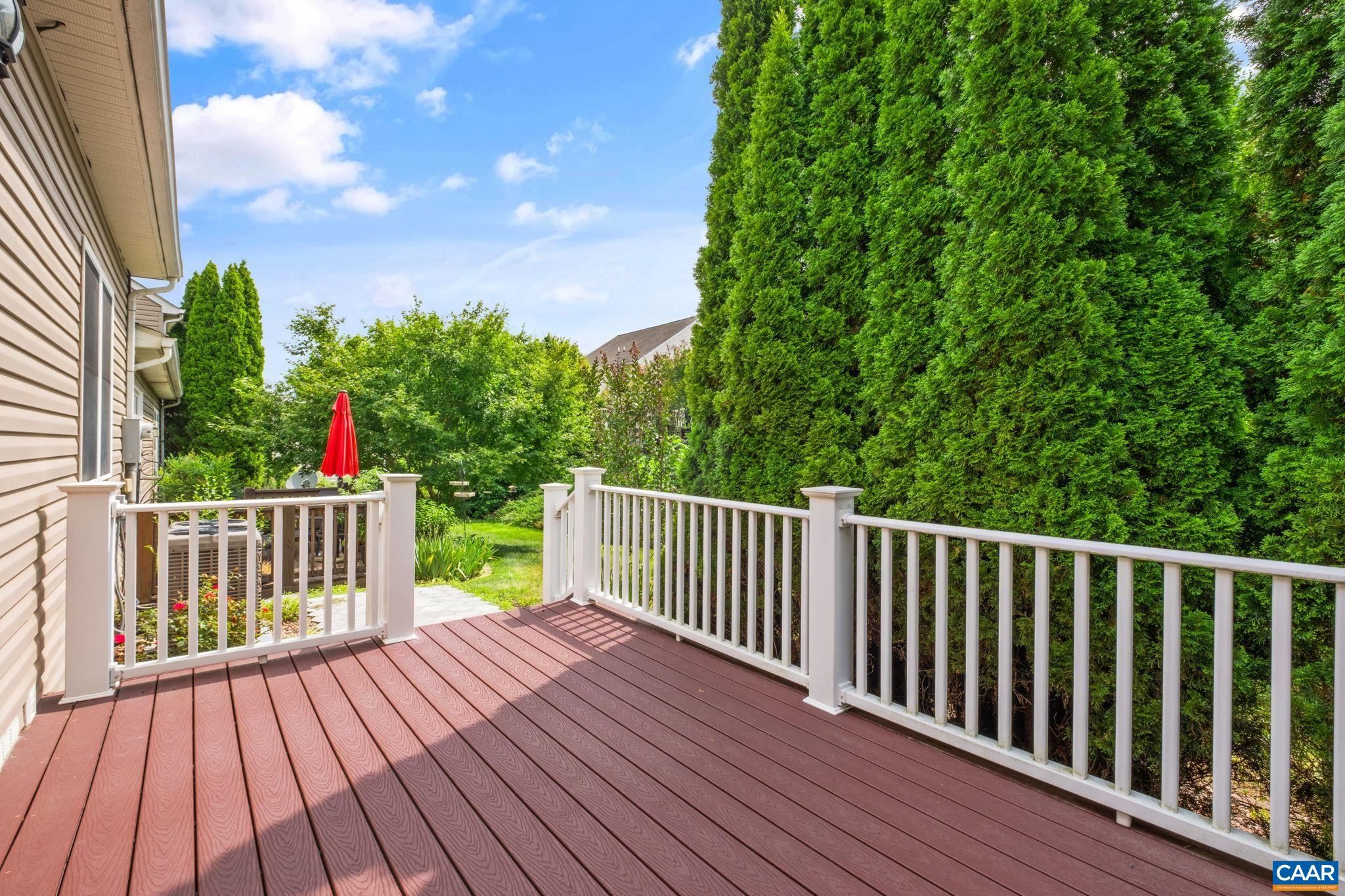 Trees line the back deck for privacy. Trees line the back deck for privacy.