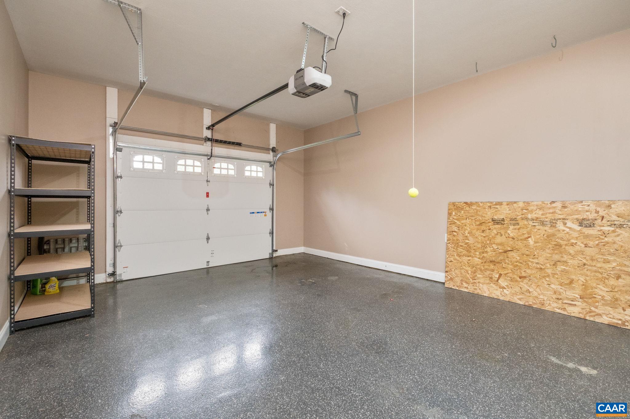The 1-car garage features an epoxy floor. The 1-car garage features an epoxy floor.