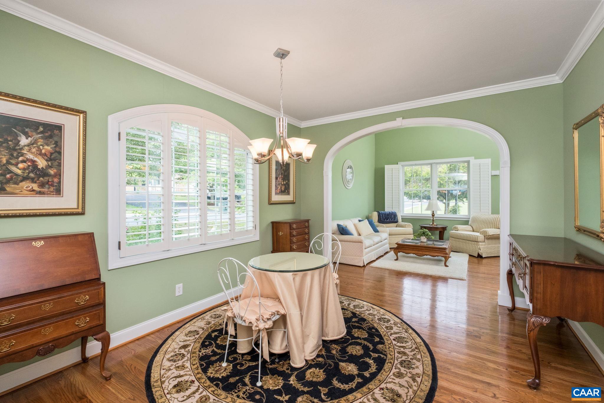The property is adorned with custom features like arches, crown molding, and keystone accents. The property is adorned with custom features like arches, crown molding, and keystone accents.